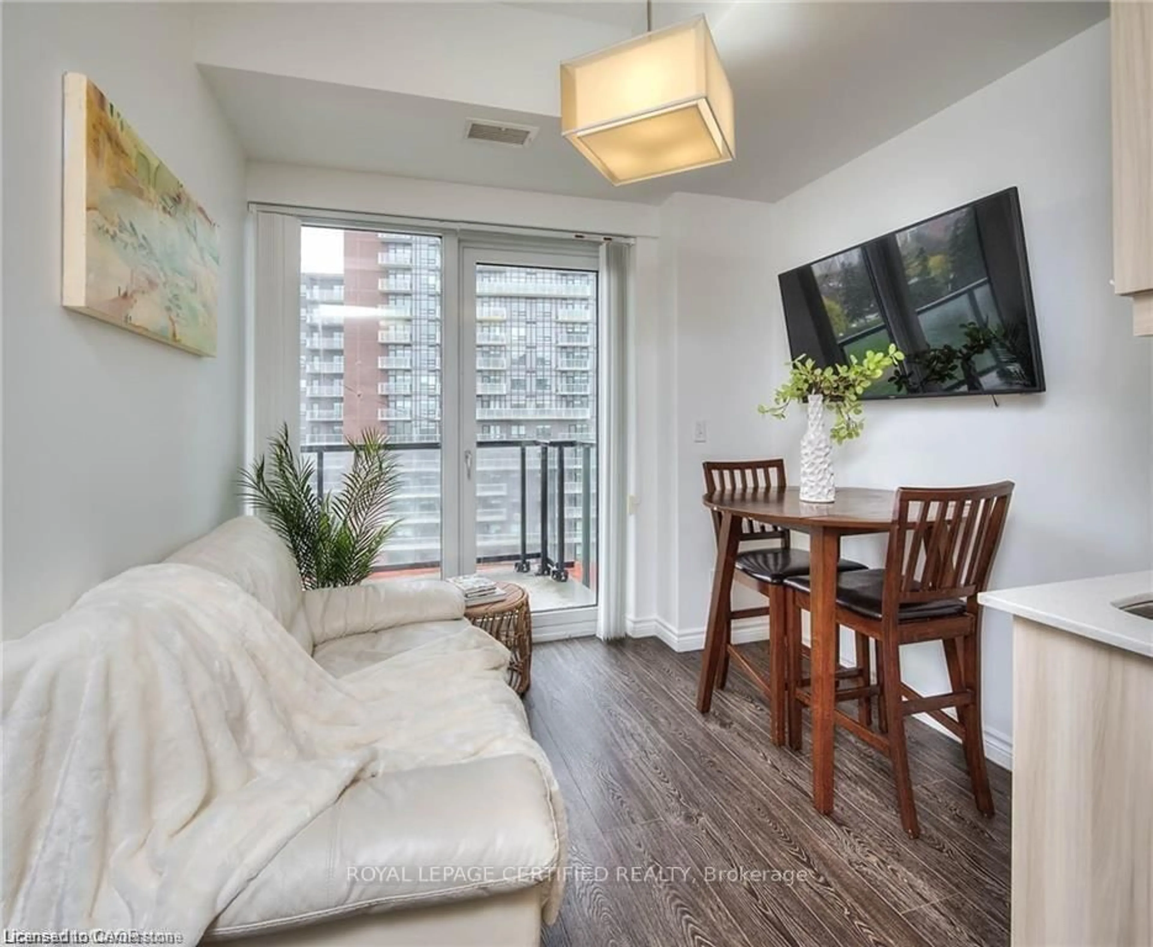 Living room with furniture, wood/laminate floor for 160 KING St #901, Waterloo Ontario N2J 2Y2