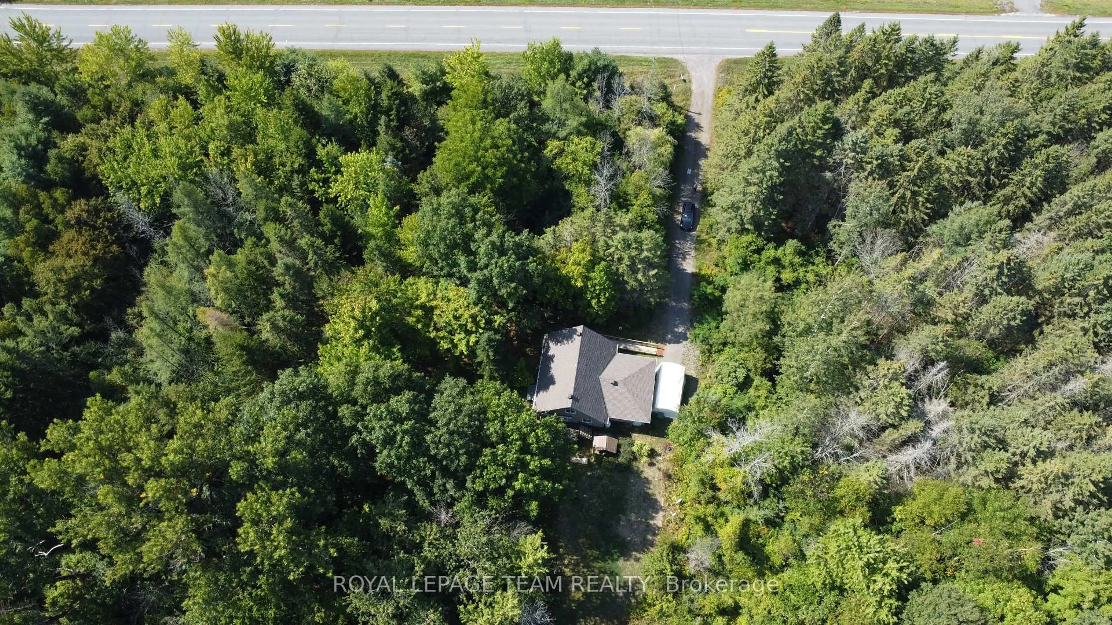 A pic from outside/outdoor area/front of a property/back of a property/a pic from drone, forest/trees view for 4465 Carman Rd, South Dundas Ontario K0E 1K0