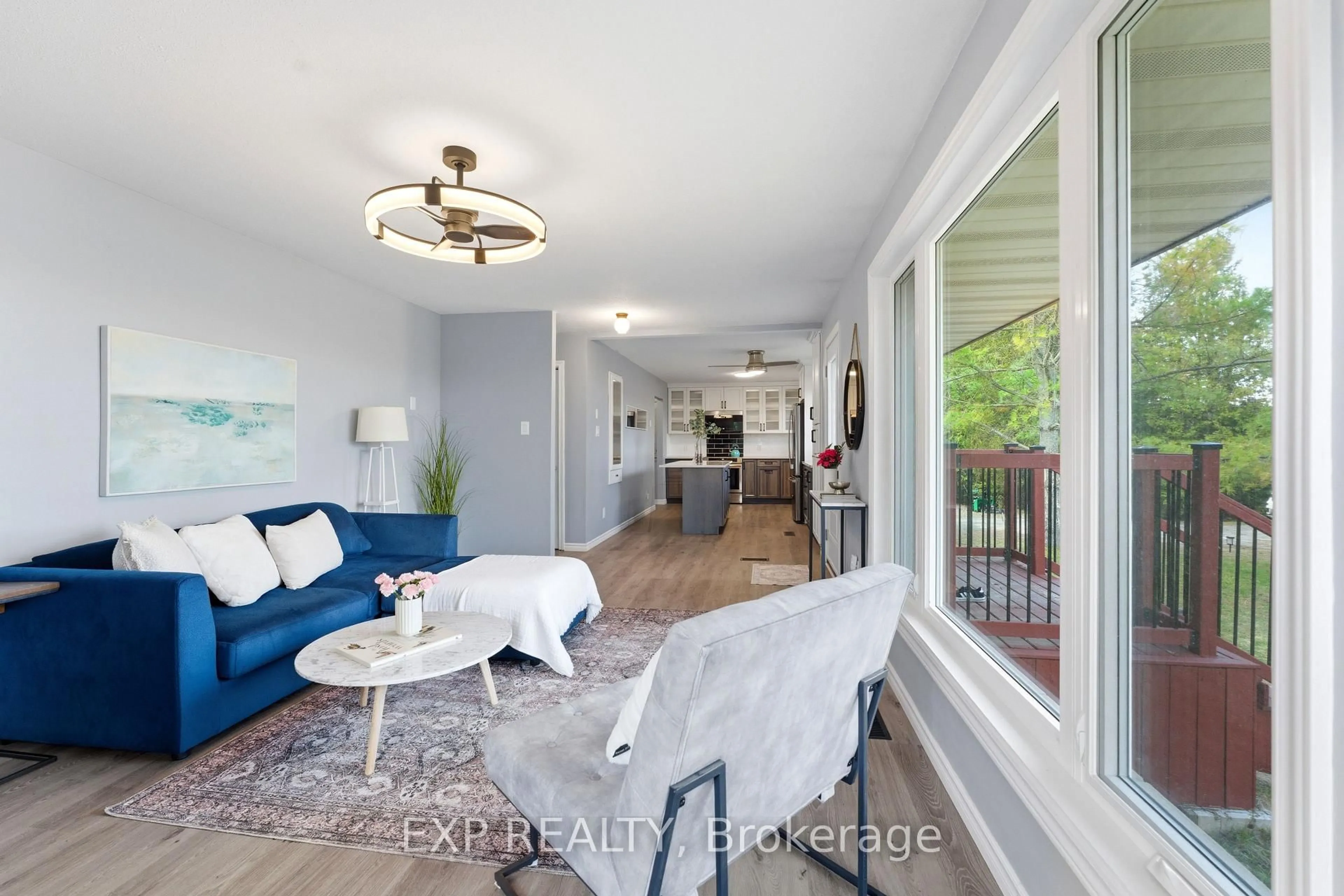 Living room with furniture, wood/laminate floor for 6794 County Rd 41 Rd, Stone Mills Ontario K0K 2A0