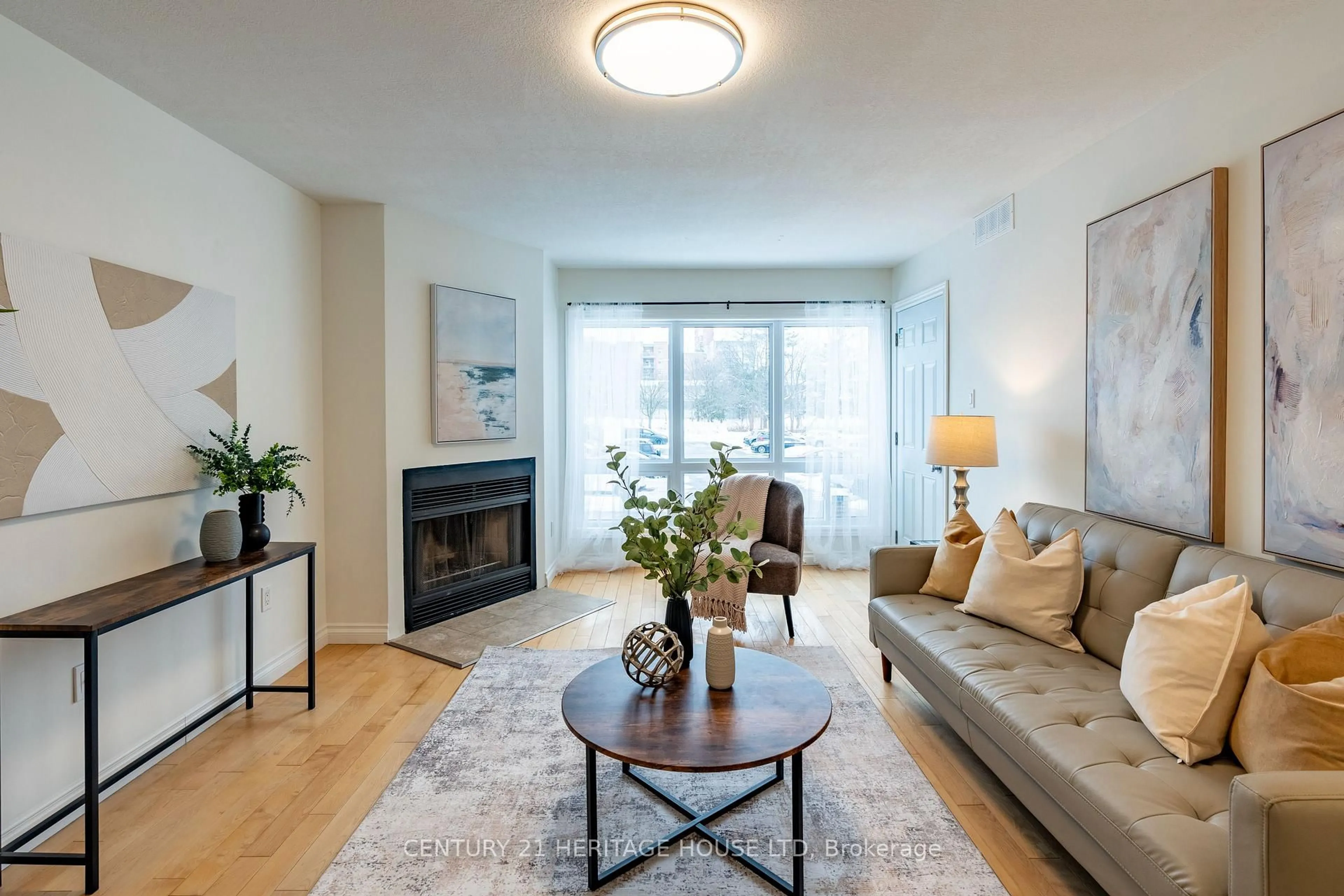 Living room with furniture, wood/laminate floor for 15 Hofstetter Ave #208, Kitchener Ontario N2A 3Z7