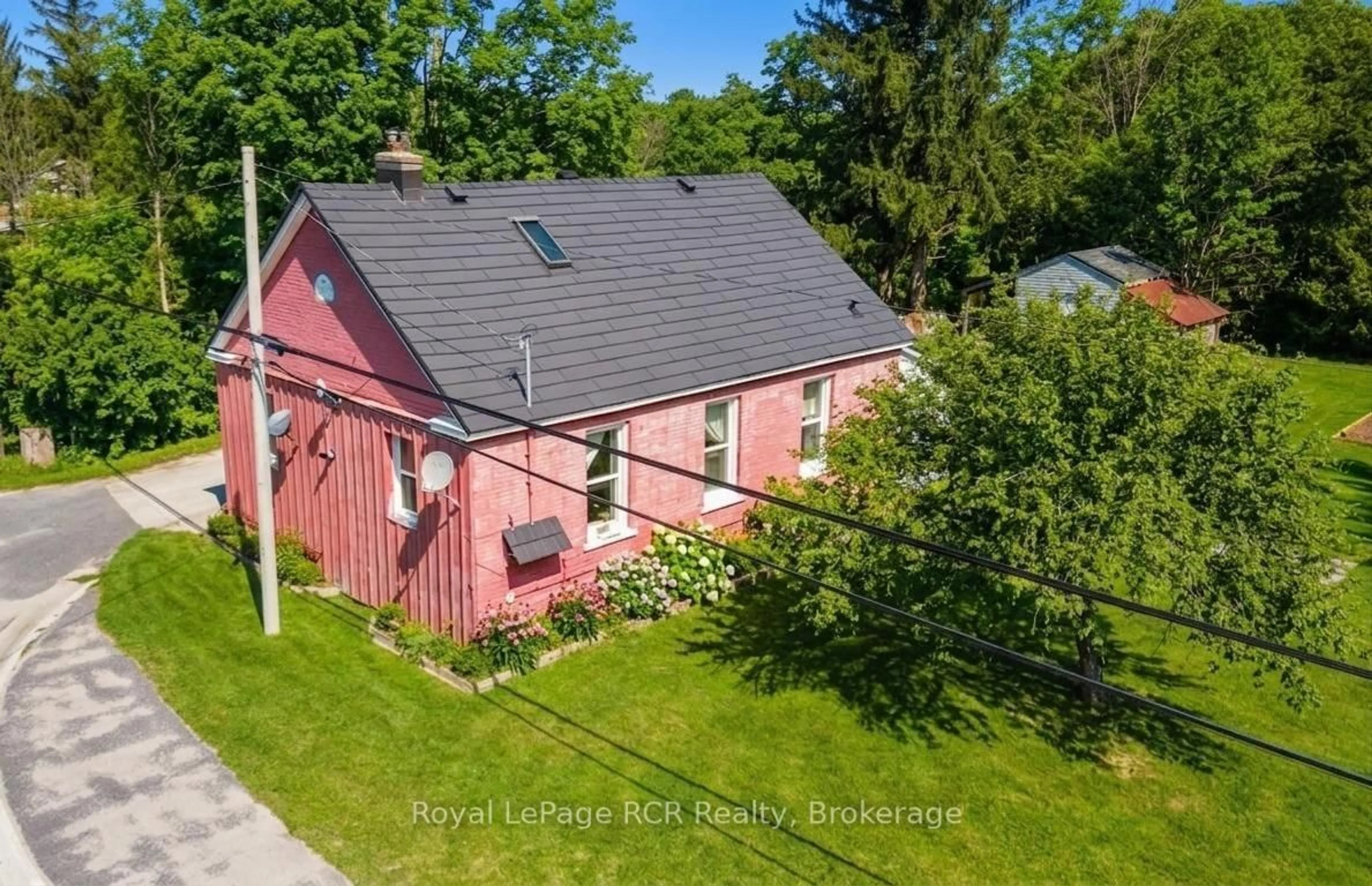 A pic from outside/outdoor area/front of a property/back of a property/a pic from drone, street for 718533 6 Highway, Georgian Bluffs Ontario N0H 2K0