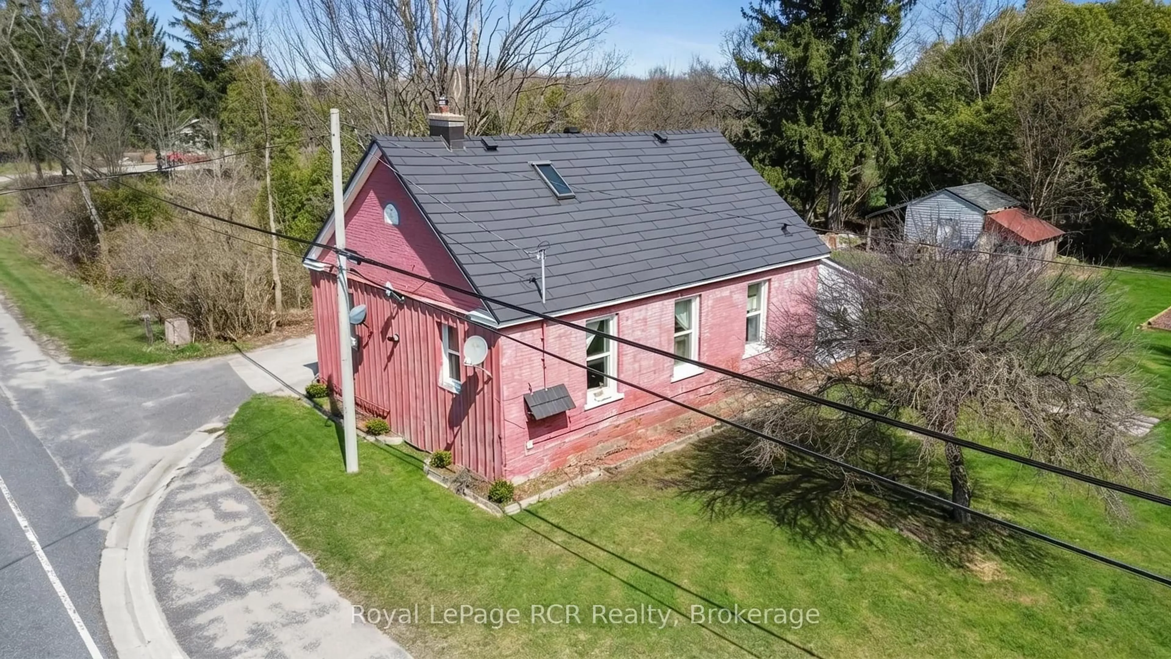 A pic from outside/outdoor area/front of a property/back of a property/a pic from drone, building for 718533 6 Highway, Georgian Bluffs Ontario N0H 2K0