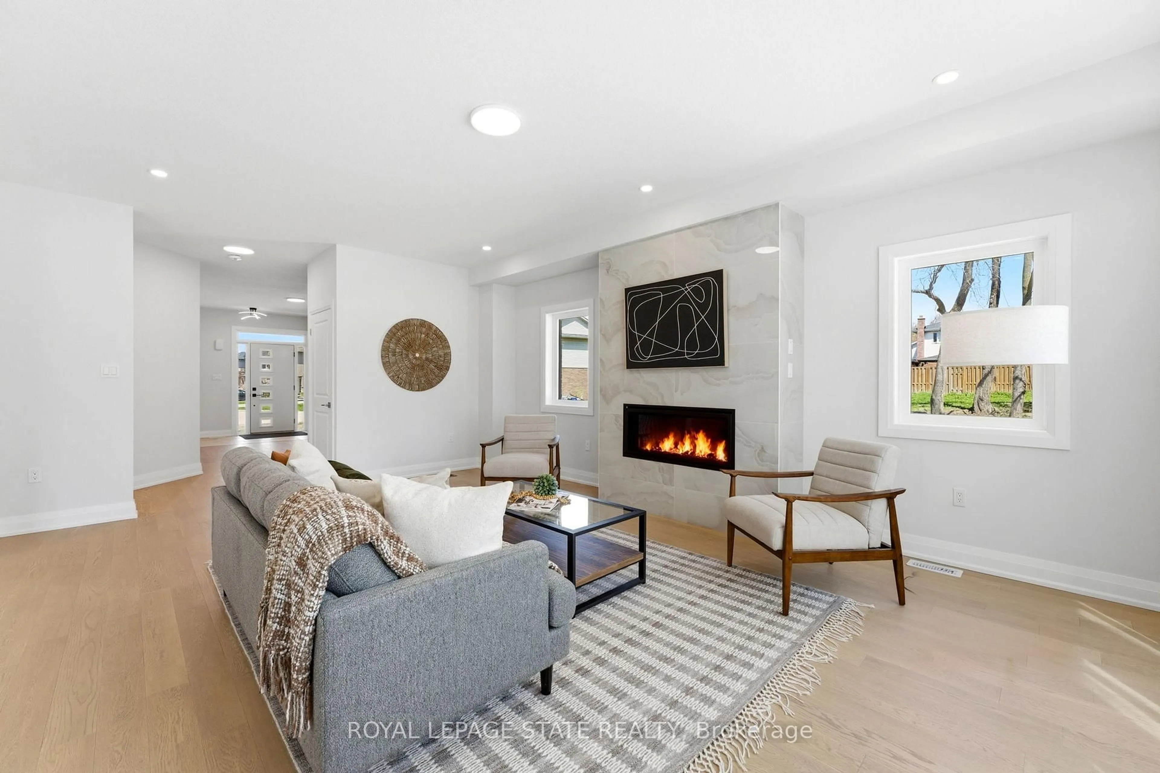 Living room with furniture, ceramic/tile floor for 23 Woodvalley Crt, Hamilton Ontario L9B 2S7