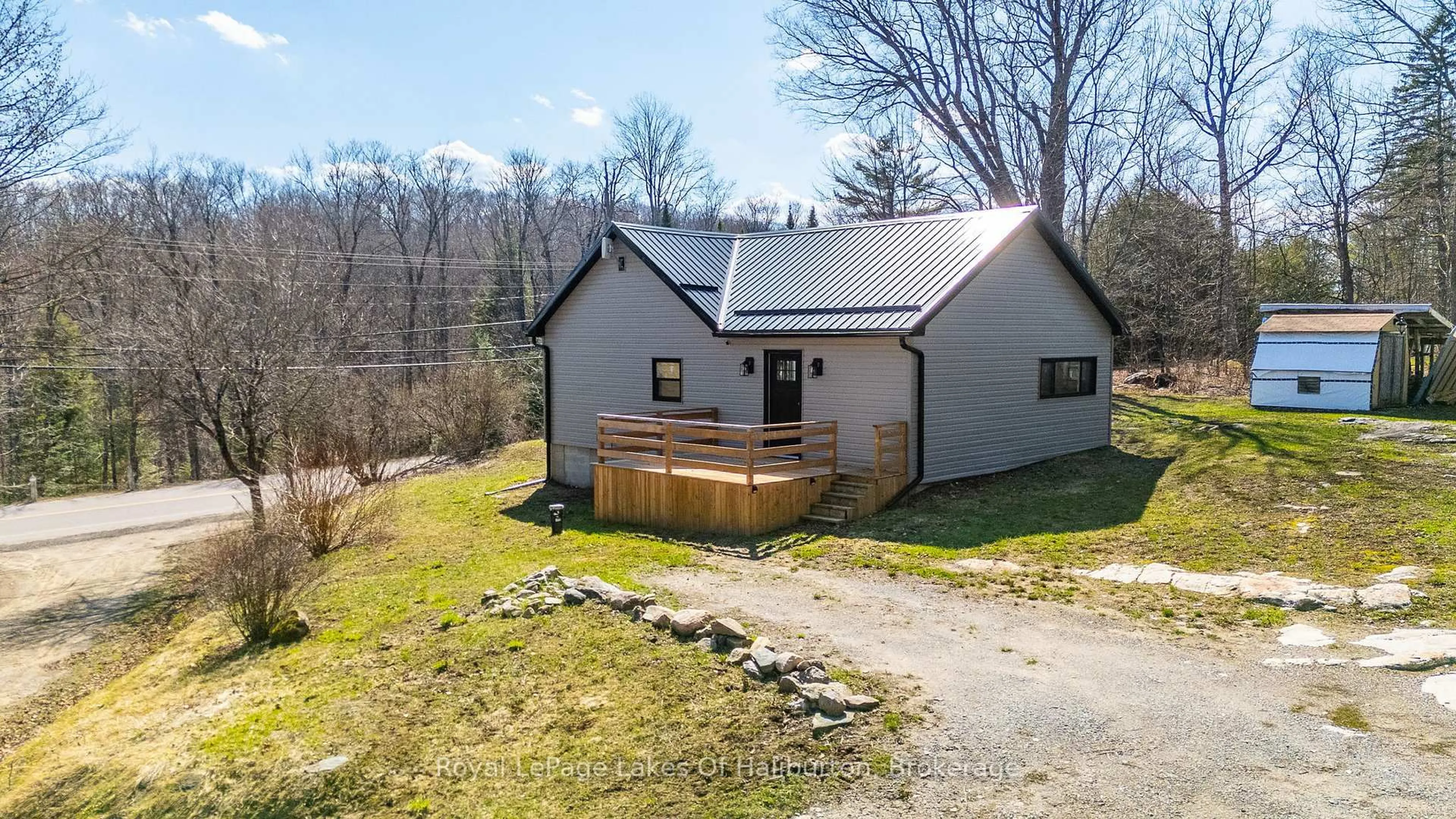 A pic from outside/outdoor area/front of a property/back of a property/a pic from drone, unknown for 10531 County Road 503, Highlands East Ontario K0M 1R0