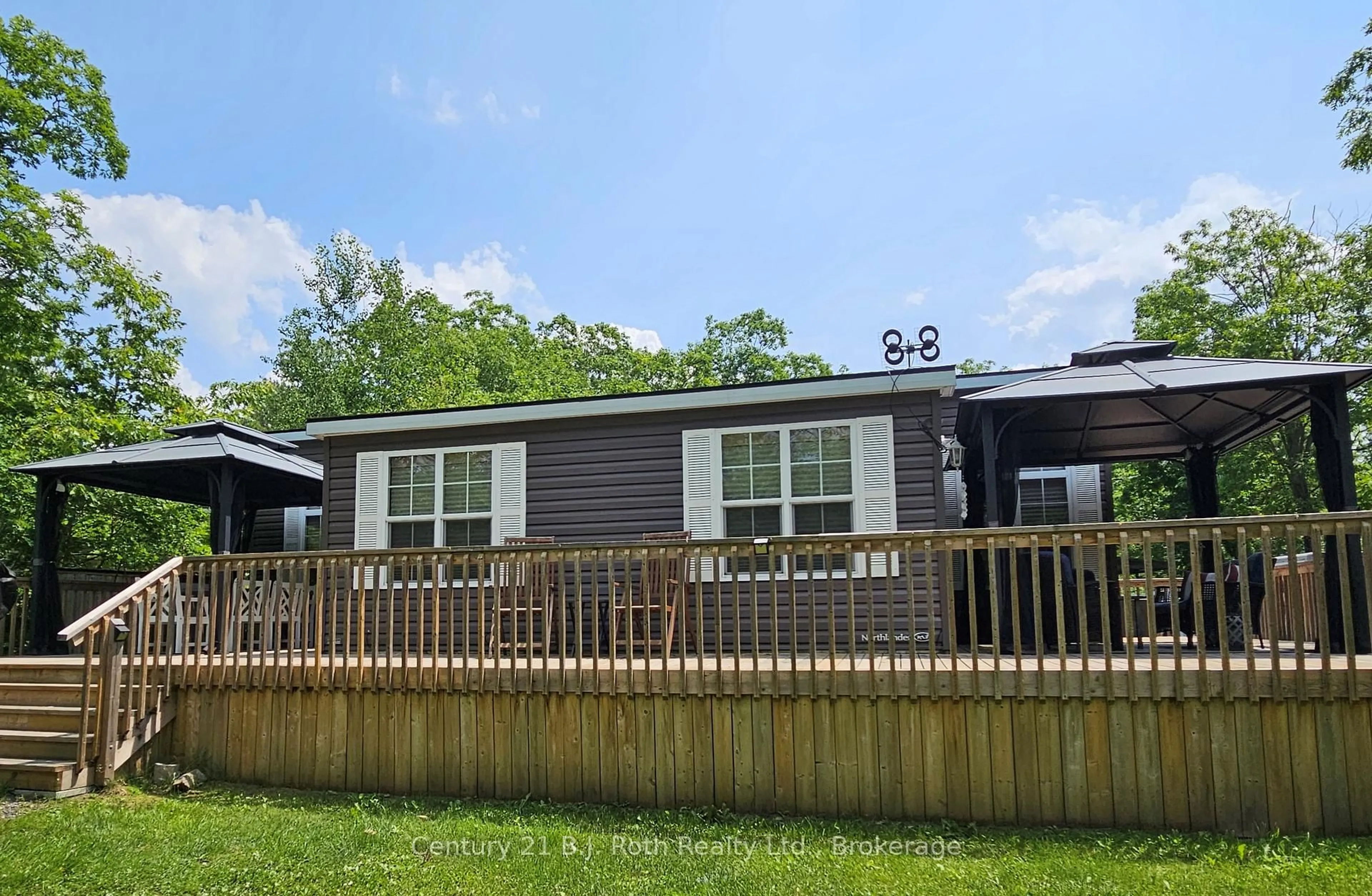 A pic from outside/outdoor area/front of a property/back of a property/a pic from drone, unknown for 1336 SOUTH MORRISON LAKE Rd #16 Morrison Creek, Gravenhurst Ontario P0E 1G0