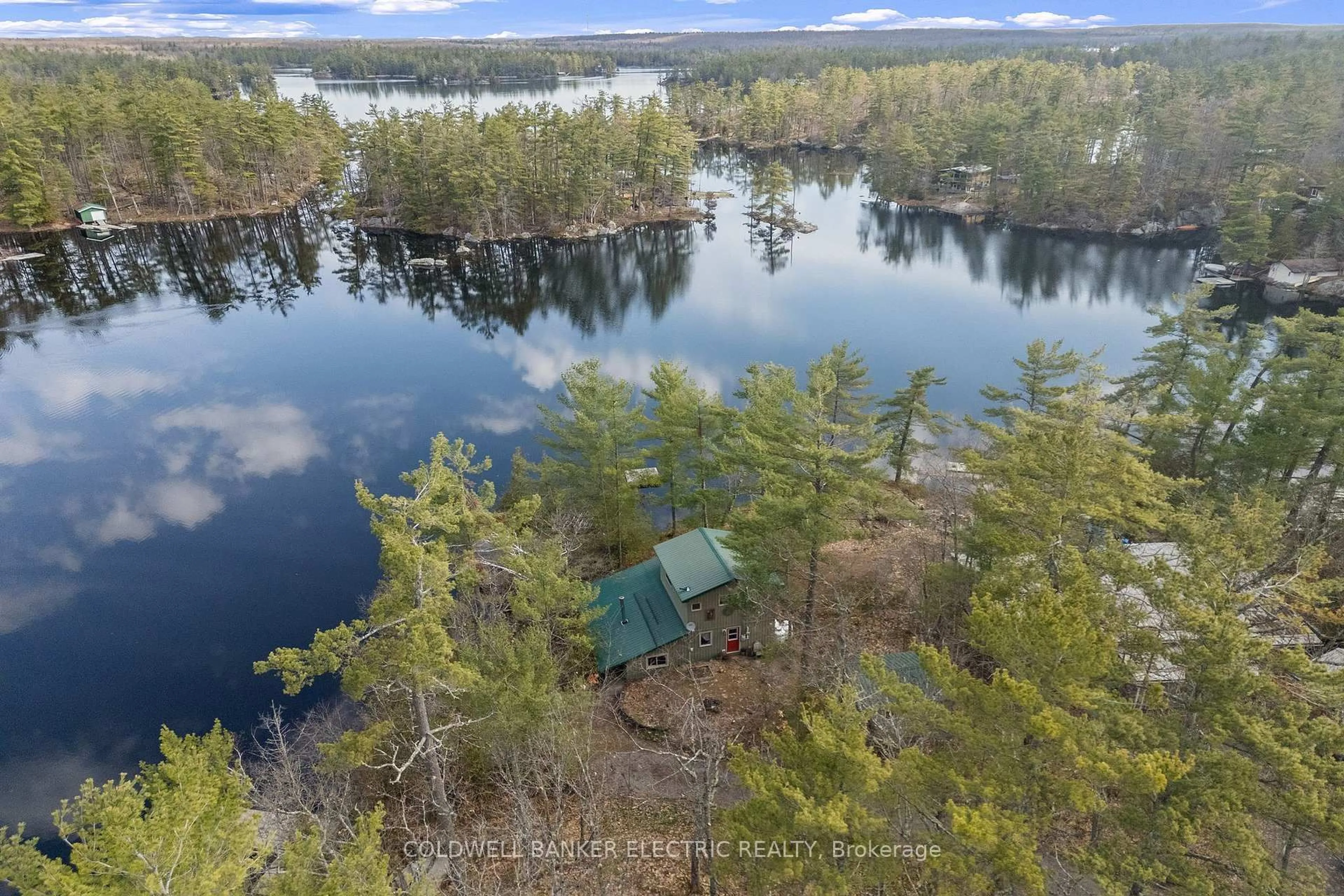 A pic from outside/outdoor area/front of a property/back of a property/a pic from drone, water/lake/river/ocean view for 2711 Channel View Lane, Selwyn Ontario K0L 2H0