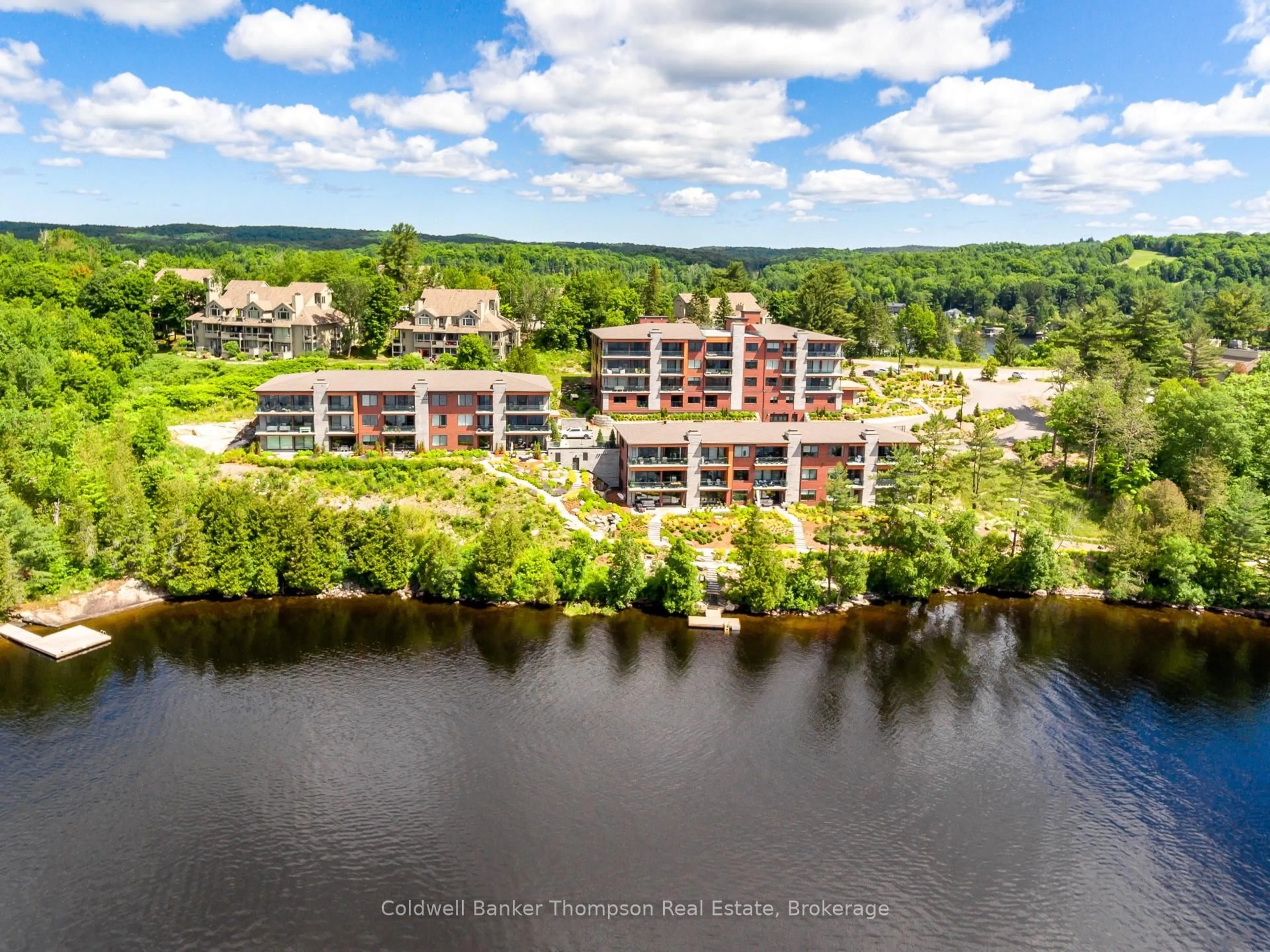 A pic from outside/outdoor area/front of a property/back of a property/a pic from drone, water/lake/river/ocean view for 727 Grandview Dr #101, Huntsville Ontario P1H 2J5