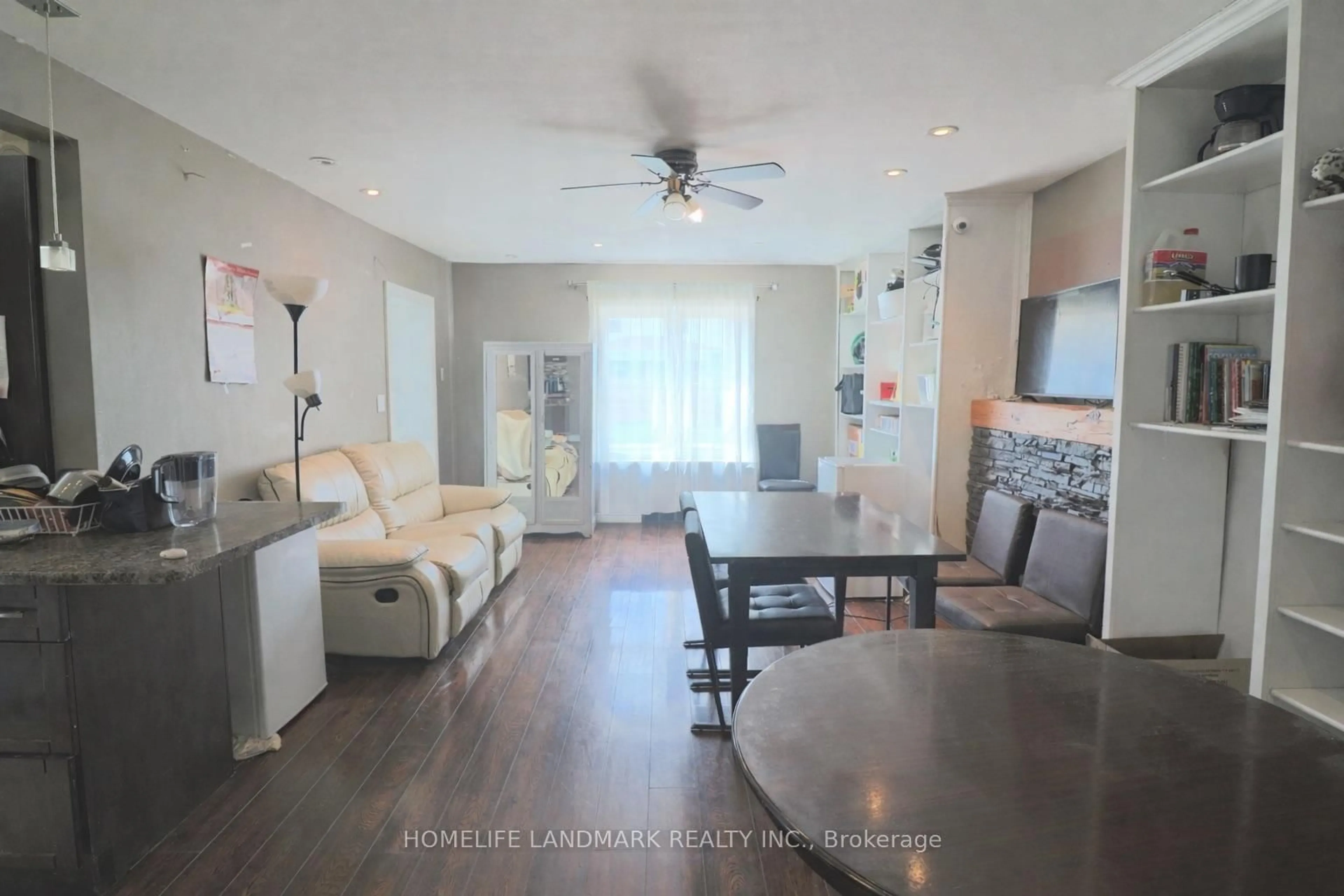 Living room with furniture, wood/laminate floor for 4664 Homewood Ave, Niagara Falls Ontario L2E 4Y2