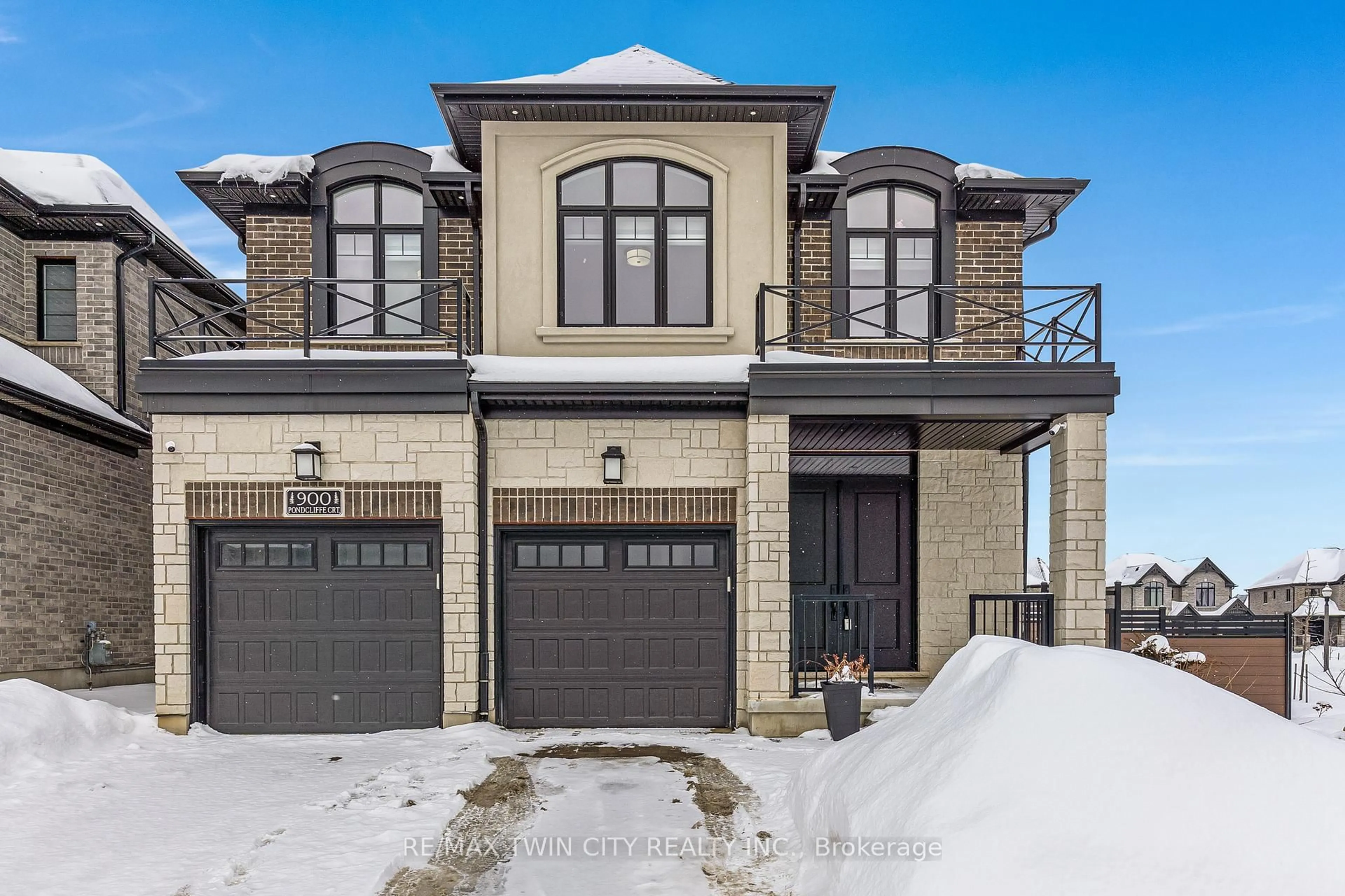 Home with brick exterior material, street for 900 Pondcliffe Dr, Kitchener Ontario N2R 0M9
