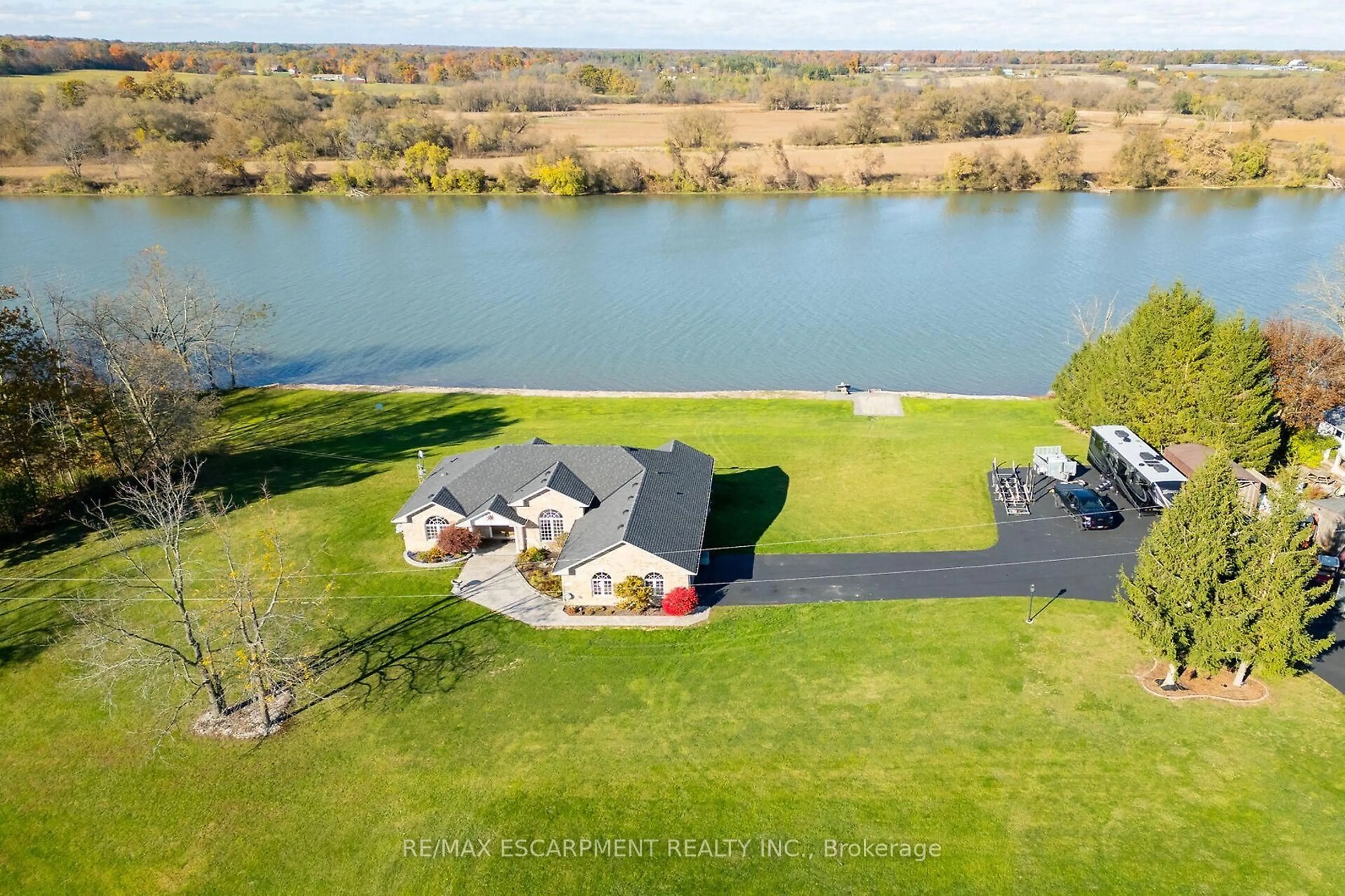 A pic from outside/outdoor area/front of a property/back of a property/a pic from drone, water/lake/river/ocean view for 1140 River Rd, Haldimand Ontario N0A 1E0