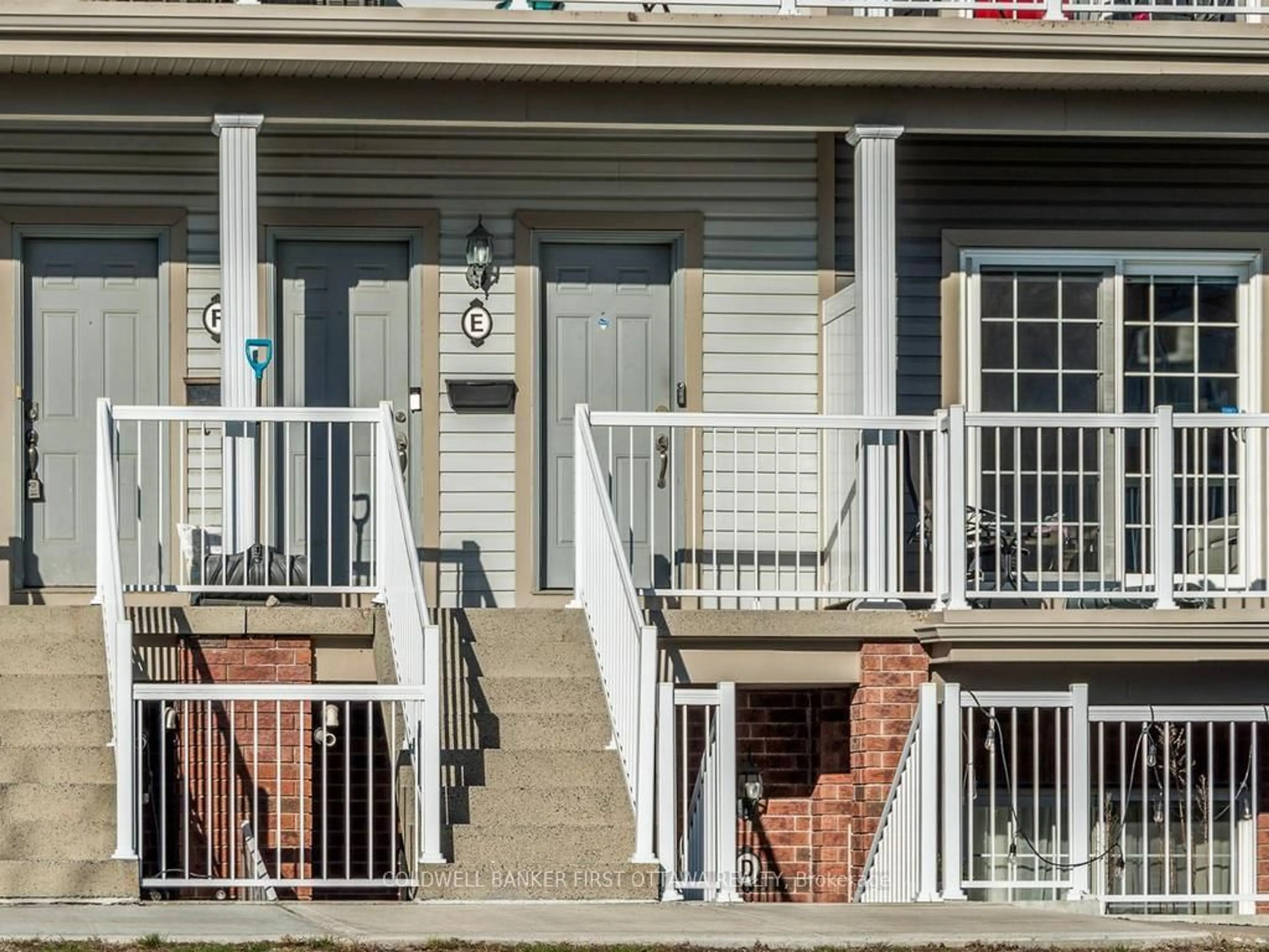 Home with vinyl exterior material, street for 100 Artesa Private #E, Ottawa Ontario K2S 0J8