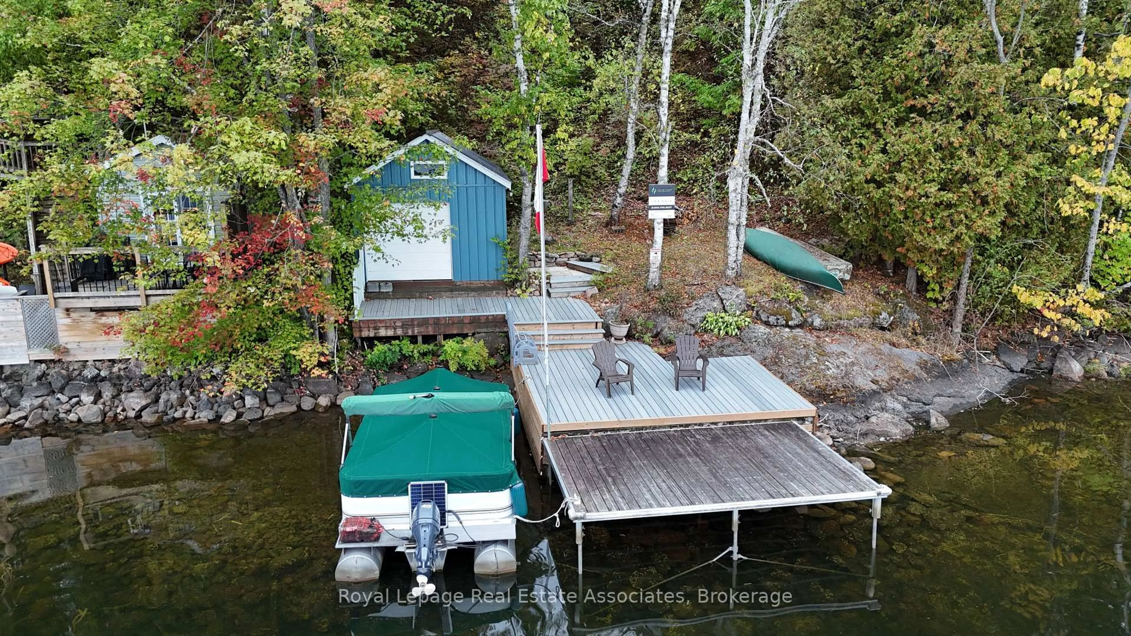 A pic from outside/outdoor area/front of a property/back of a property/a pic from drone, water/lake/river/ocean view for 398 Gilbert Bay Lane, Coe Hill Ontario K0L 1P0