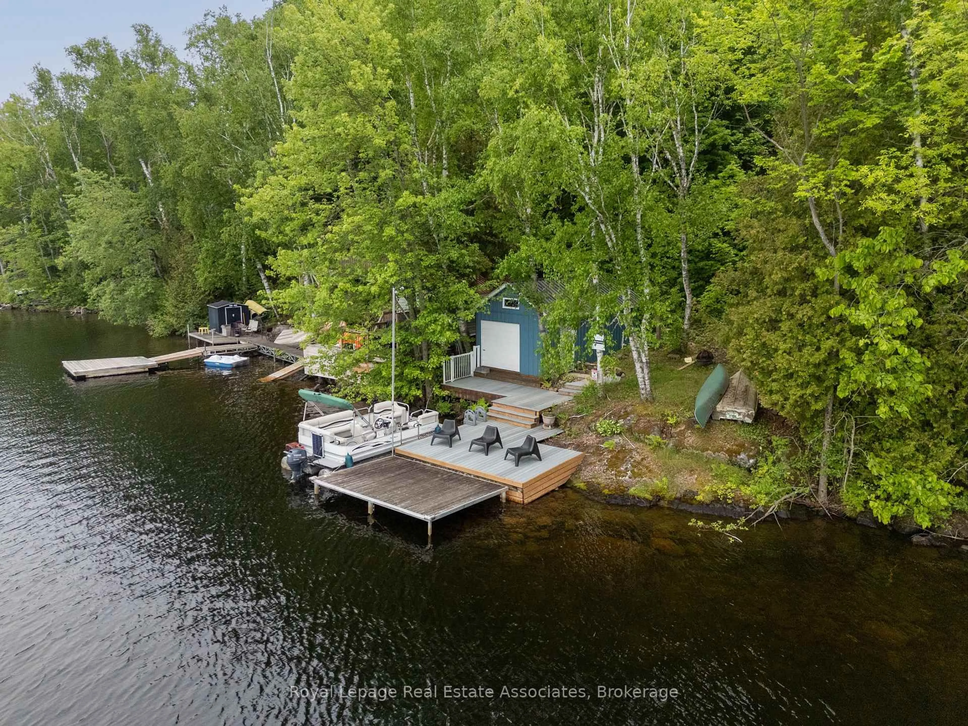A pic from outside/outdoor area/front of a property/back of a property/a pic from drone, water/lake/river/ocean view for 398 Gilbert Bay Lane, Coe Hill Ontario K0L 1P0