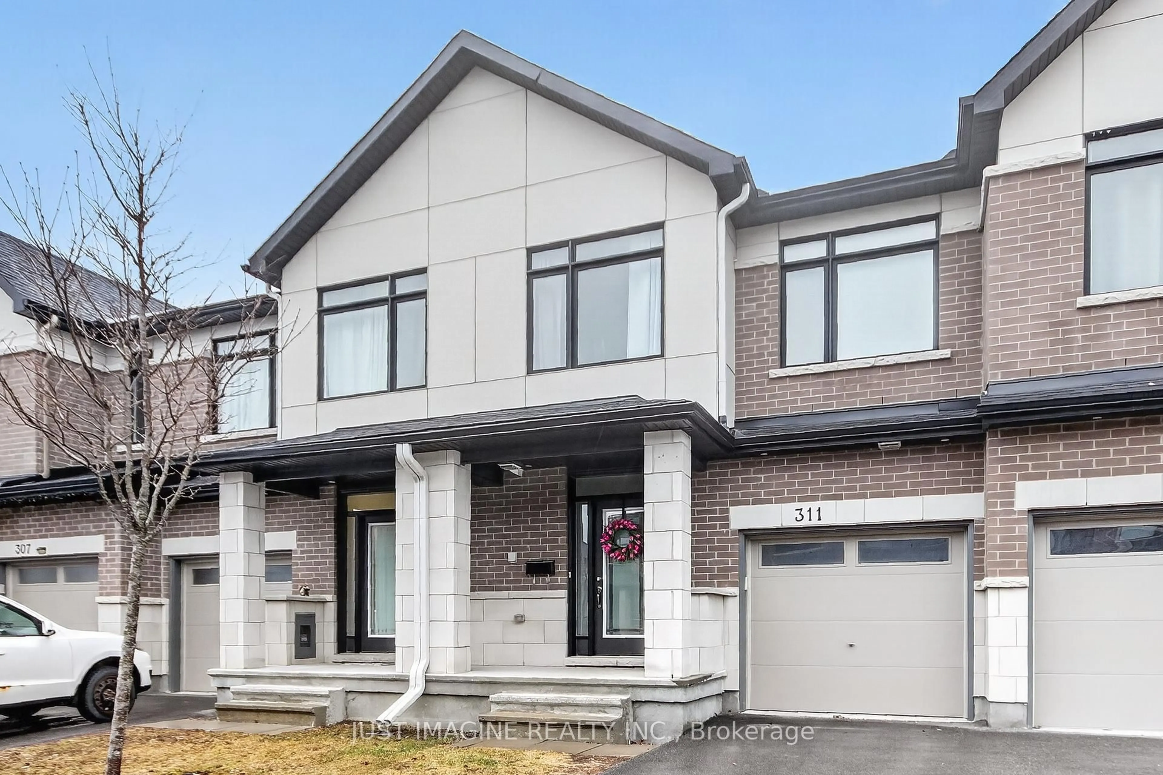 Home with brick exterior material, street for 311 Ibanez Walk, Ottawa Ontario K1T 0V8
