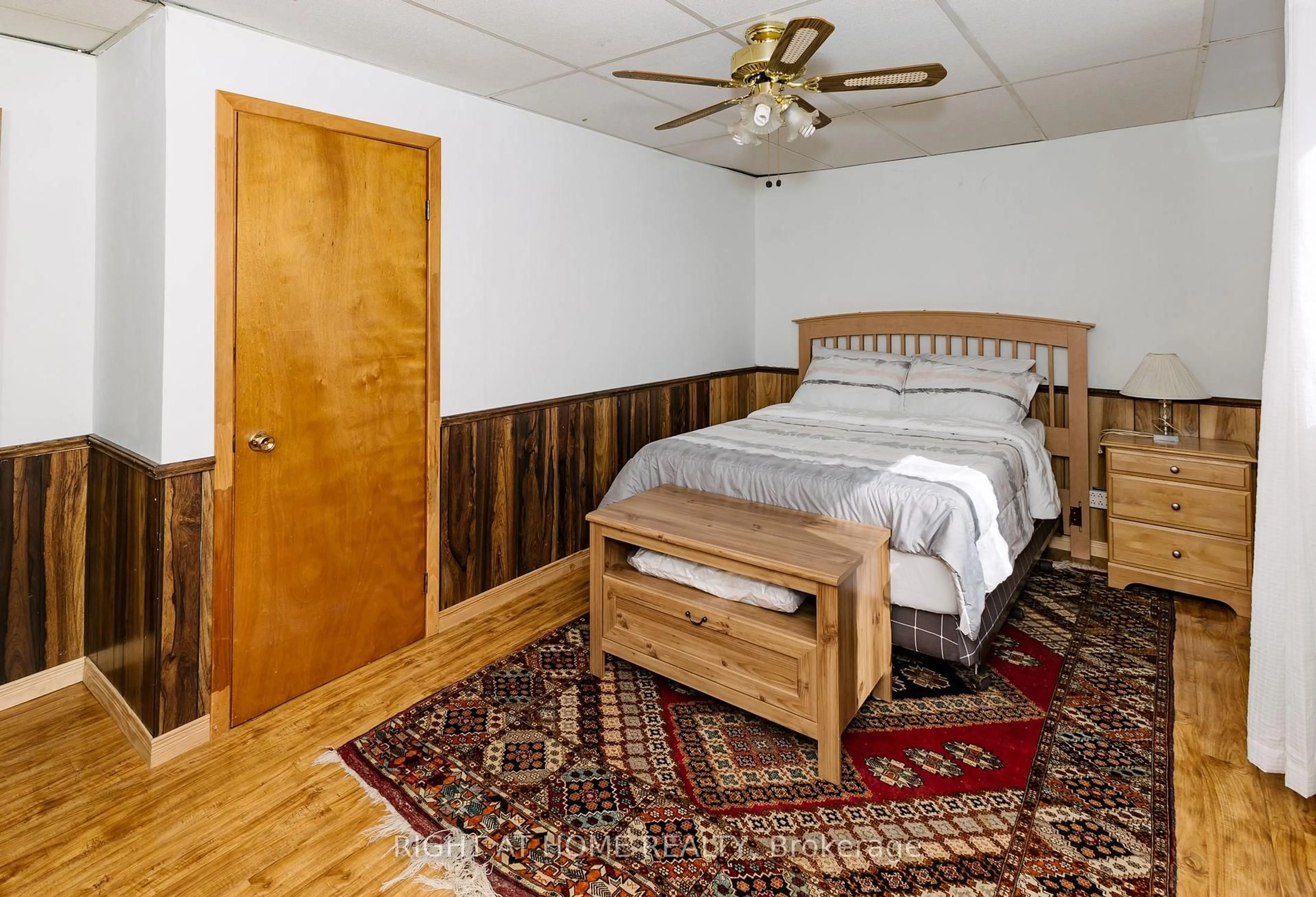 Bedroom with bed, wood/laminate floor for 16366 Hwy 35, Algonquin Highlands Ontario K0M 2K0