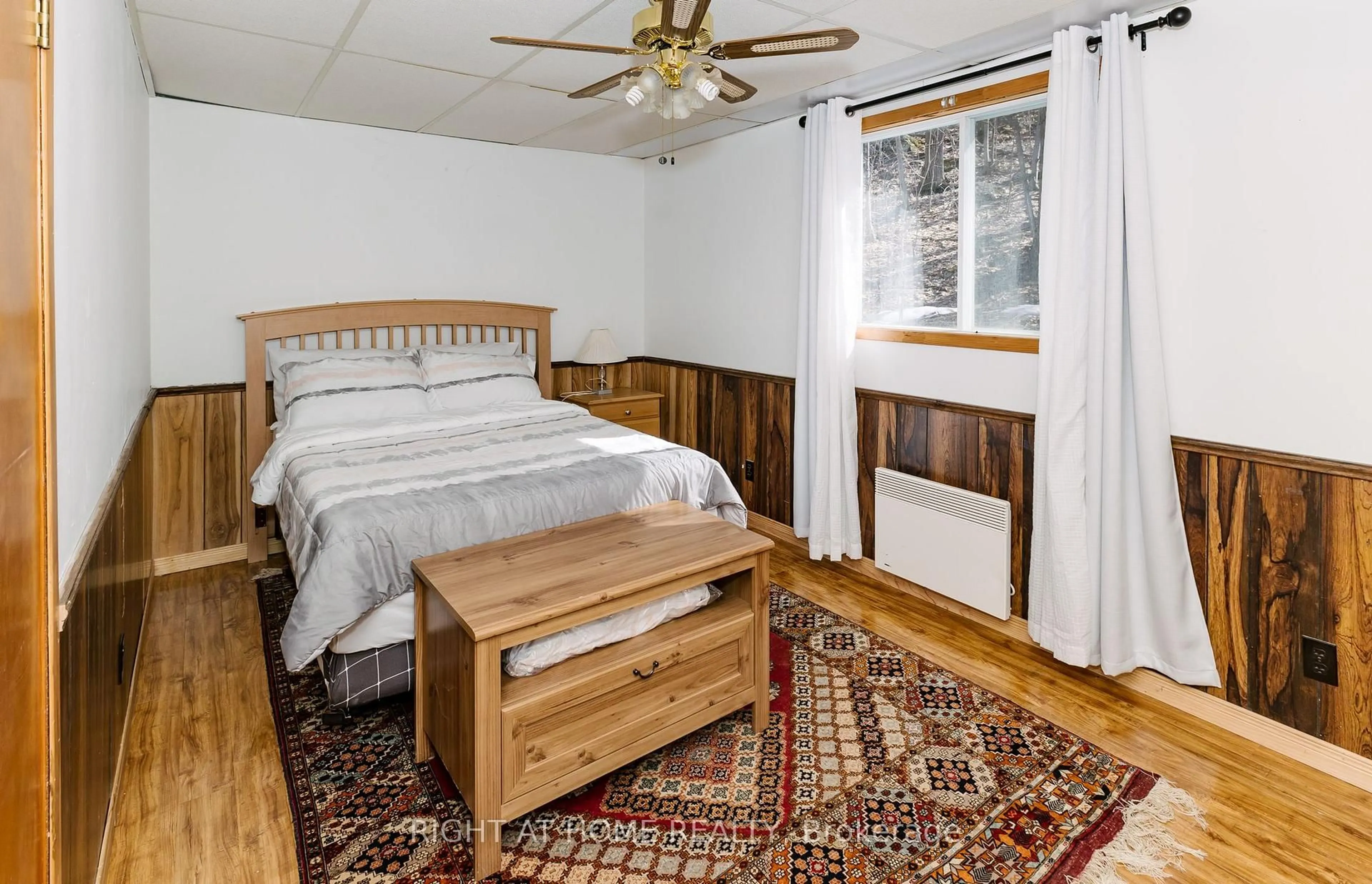 Bedroom with bed, wood/laminate floor for 16366 Hwy 35, Algonquin Highlands Ontario K0M 2K0