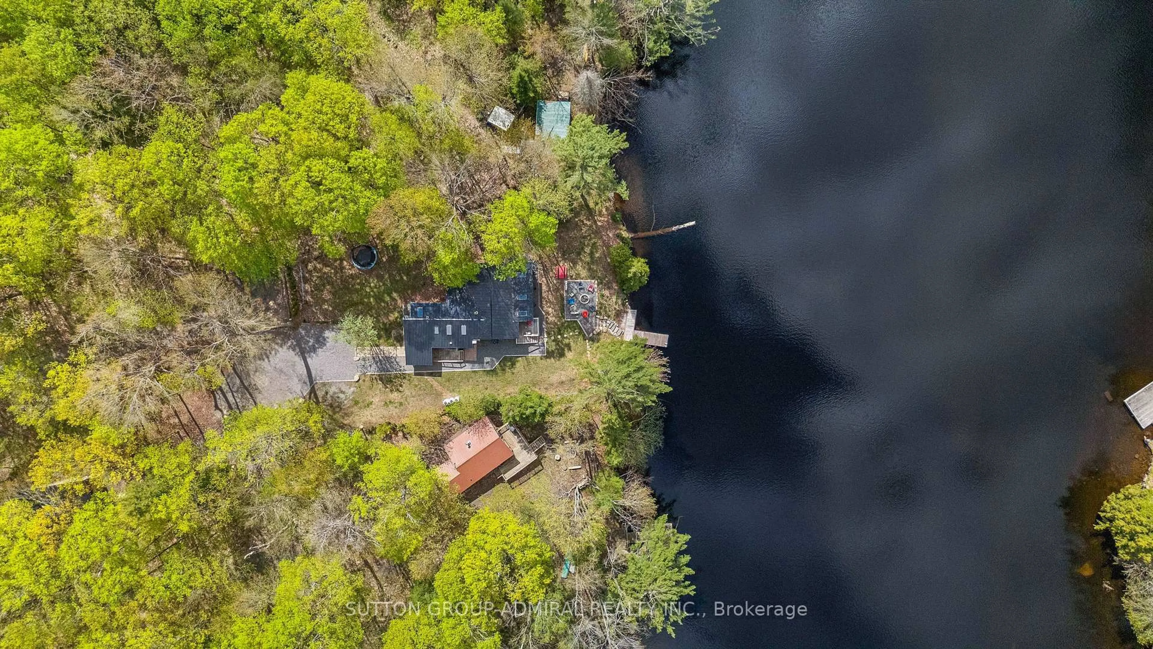 A pic from outside/outdoor area/front of a property/back of a property/a pic from drone, water/lake/river/ocean view for 1023 Kirkpatrick Lane, Bracebridge Ontario P1L 1X1