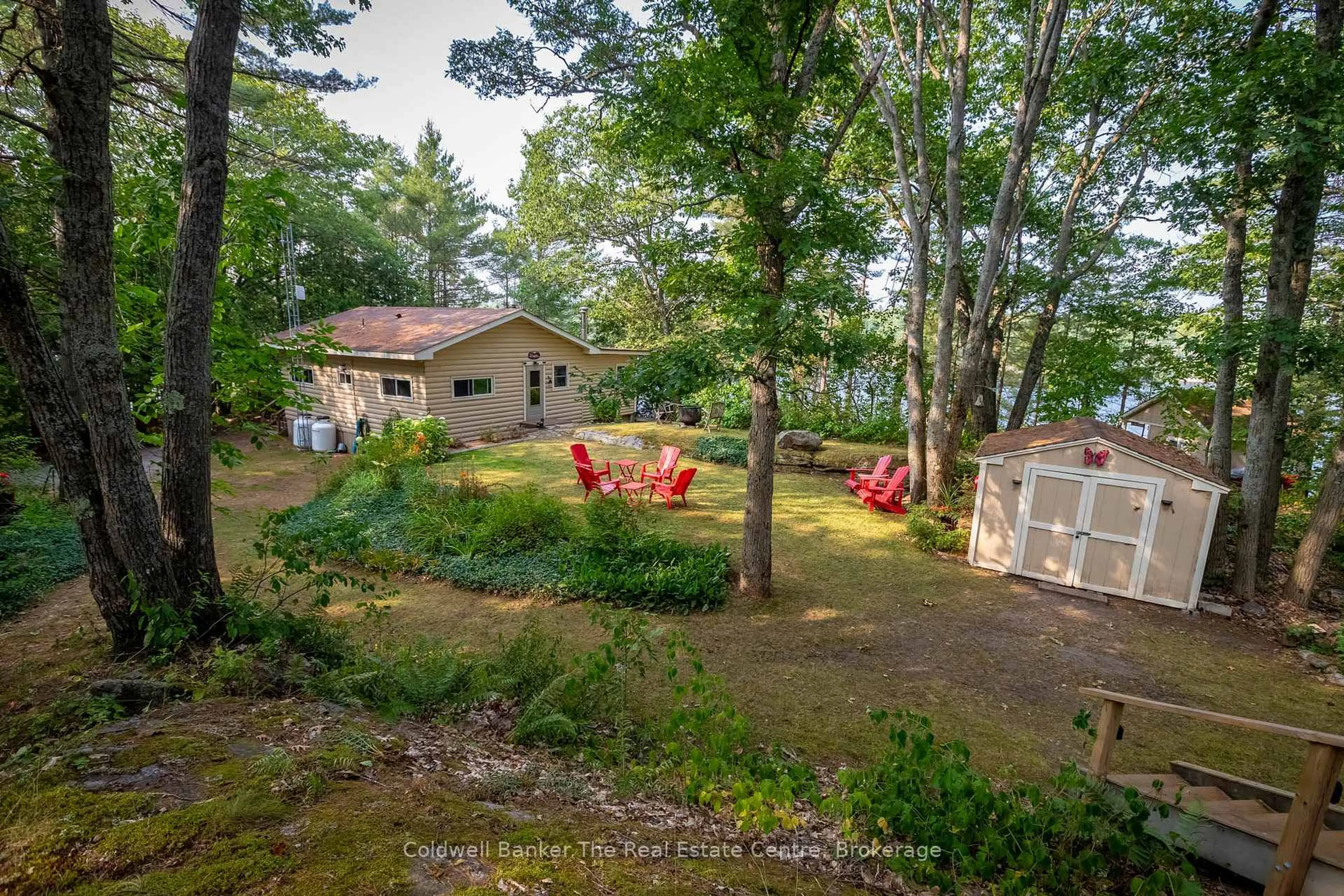 A pic from outside/outdoor area/front of a property/back of a property/a pic from drone, forest/trees view for 11 Drury Lane, Gravenhurst Ontario P1P 1R2