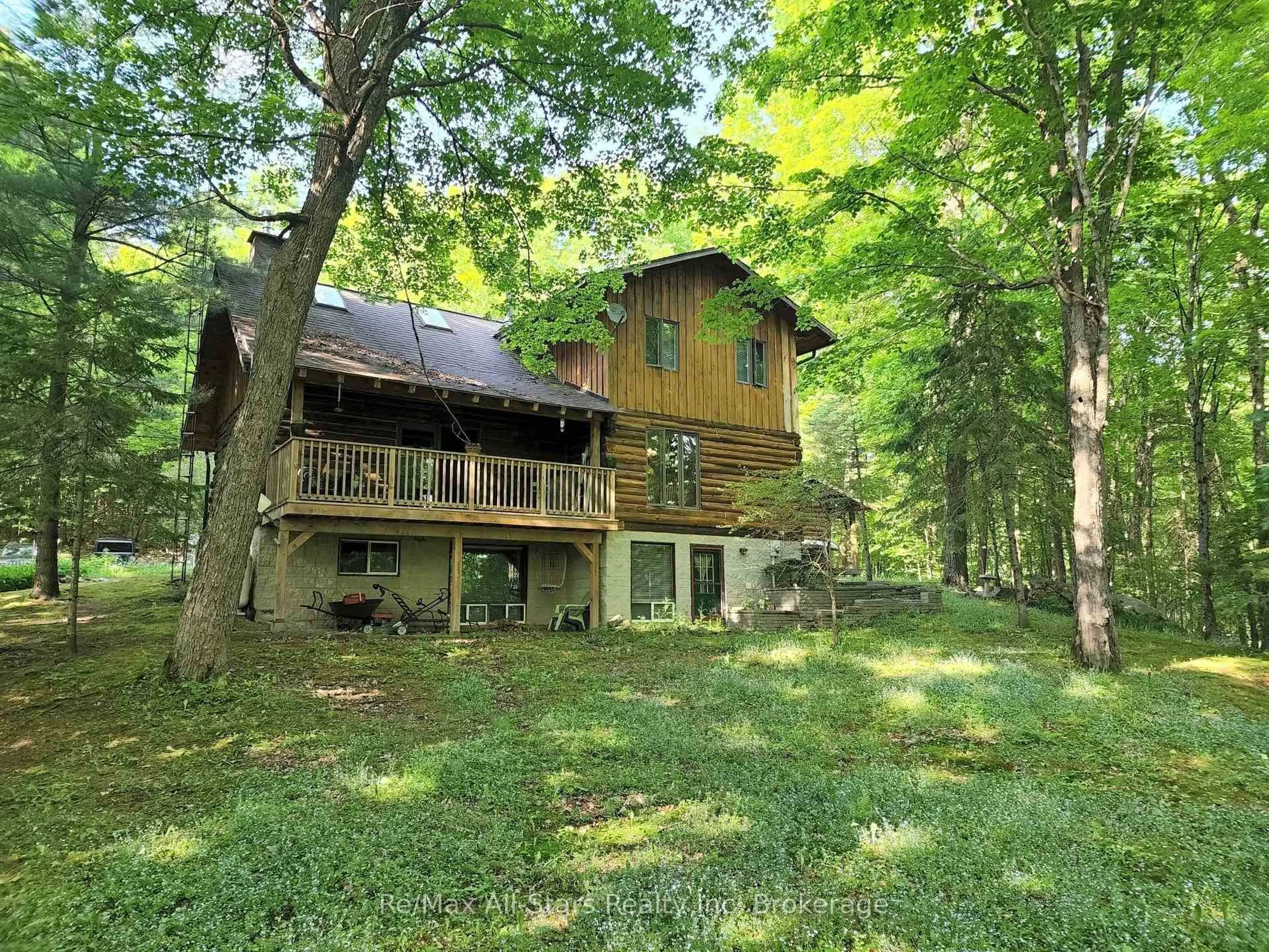 A pic from outside/outdoor area/front of a property/back of a property/a pic from drone, forest/trees view for 1386 South Portage Rd, Lake of Bays Ontario P1H 2J6
