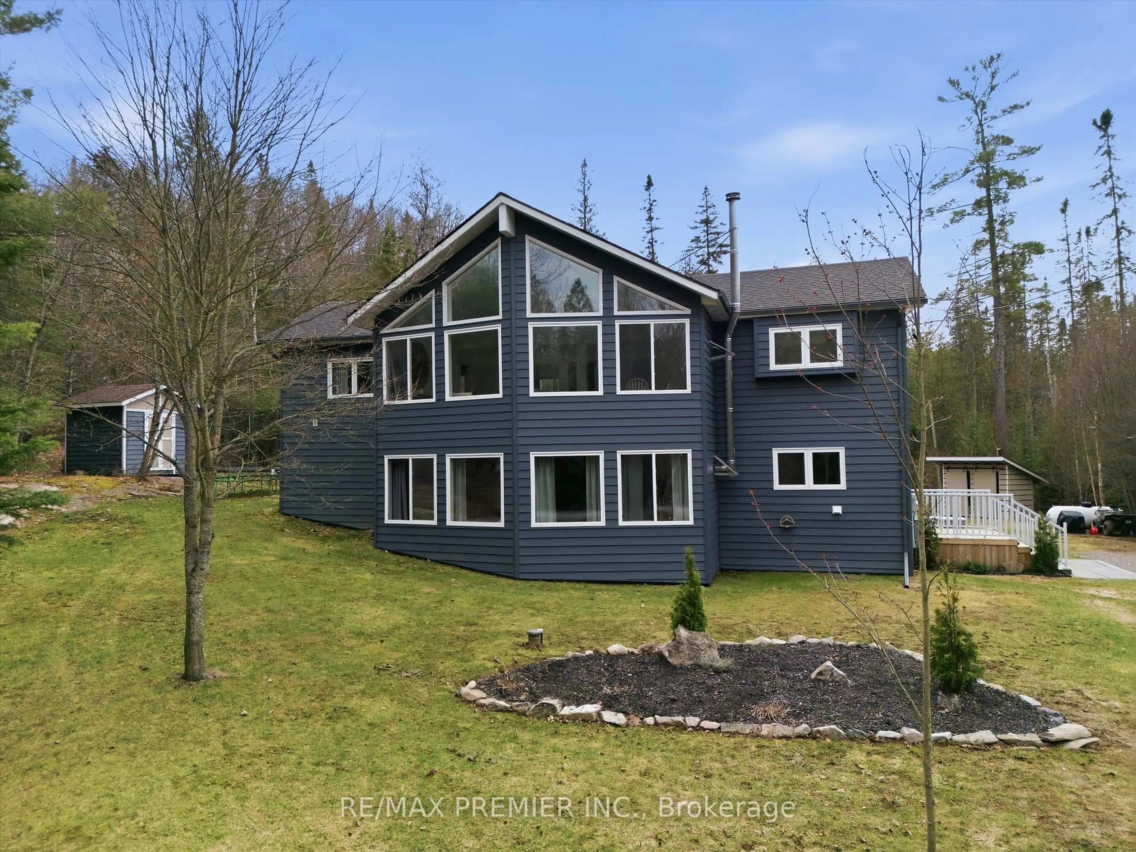 A pic from outside/outdoor area/front of a property/back of a property/a pic from drone, water/lake/river/ocean view for 1131 Springdale Park Rd, Bracebridge Ontario P1L 1W9