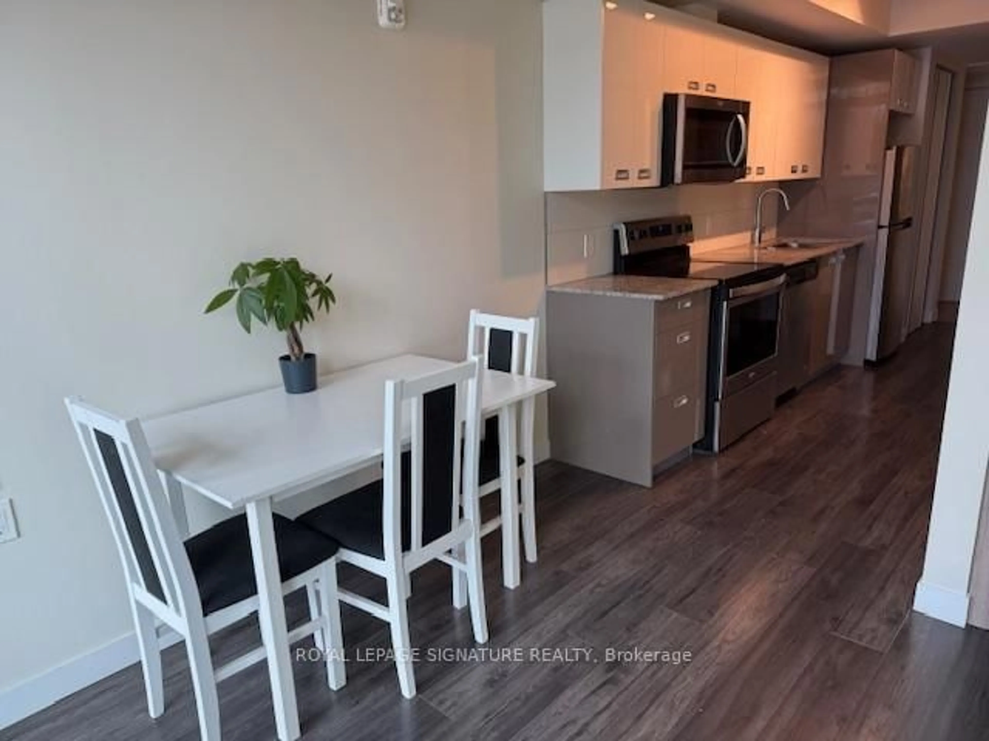 Open concept kitchen, wood/laminate floor for 257 Hemlock St #16, Waterloo Ontario N2L 3R4
