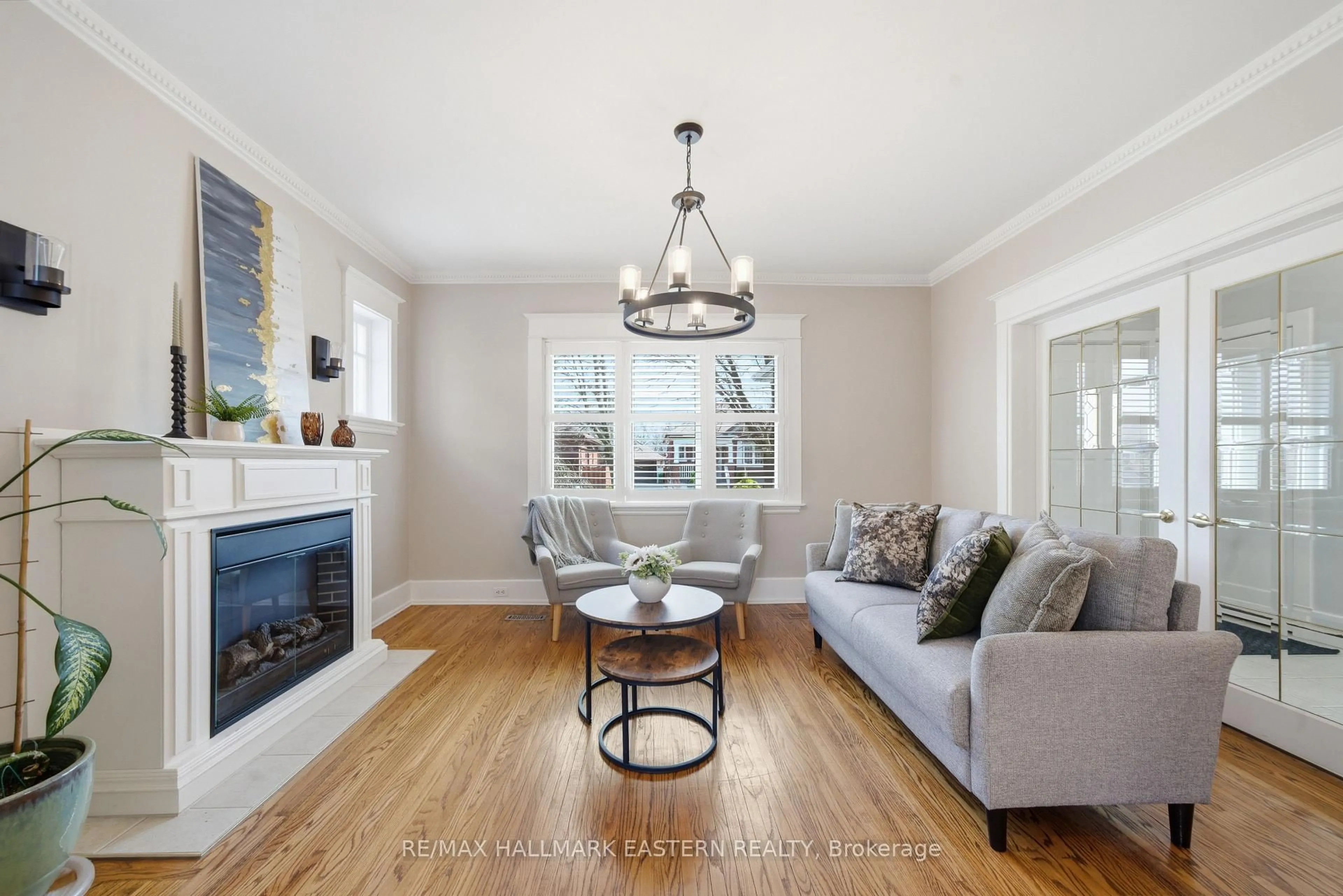 Living room with furniture, wood/laminate floor for 556 Douglas Ave, Peterborough Ontario K9J 4L1