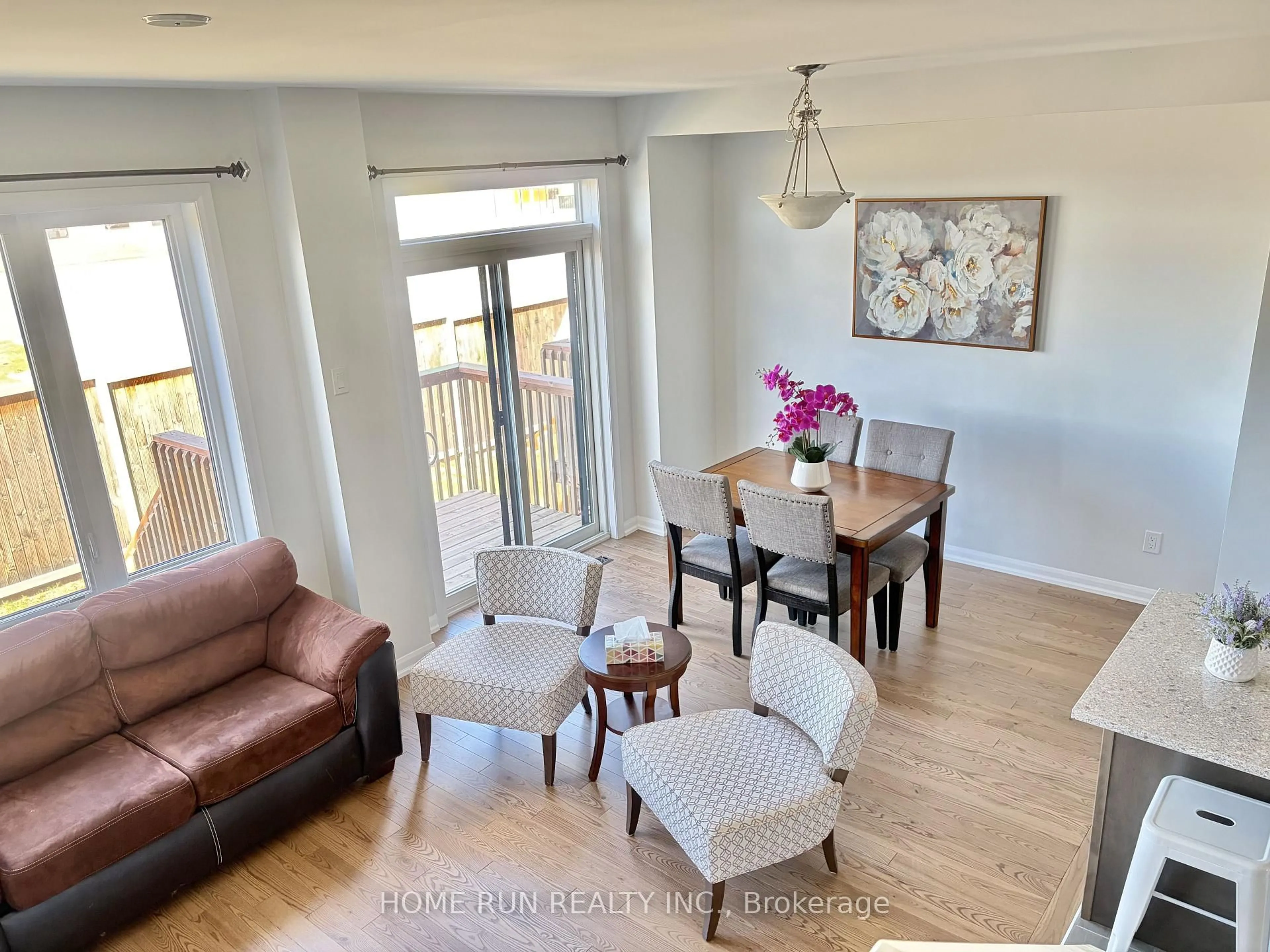 Living room with furniture, wood/laminate floor for 111 TEELIN Circ, Ottawa Ontario K2C 3H2