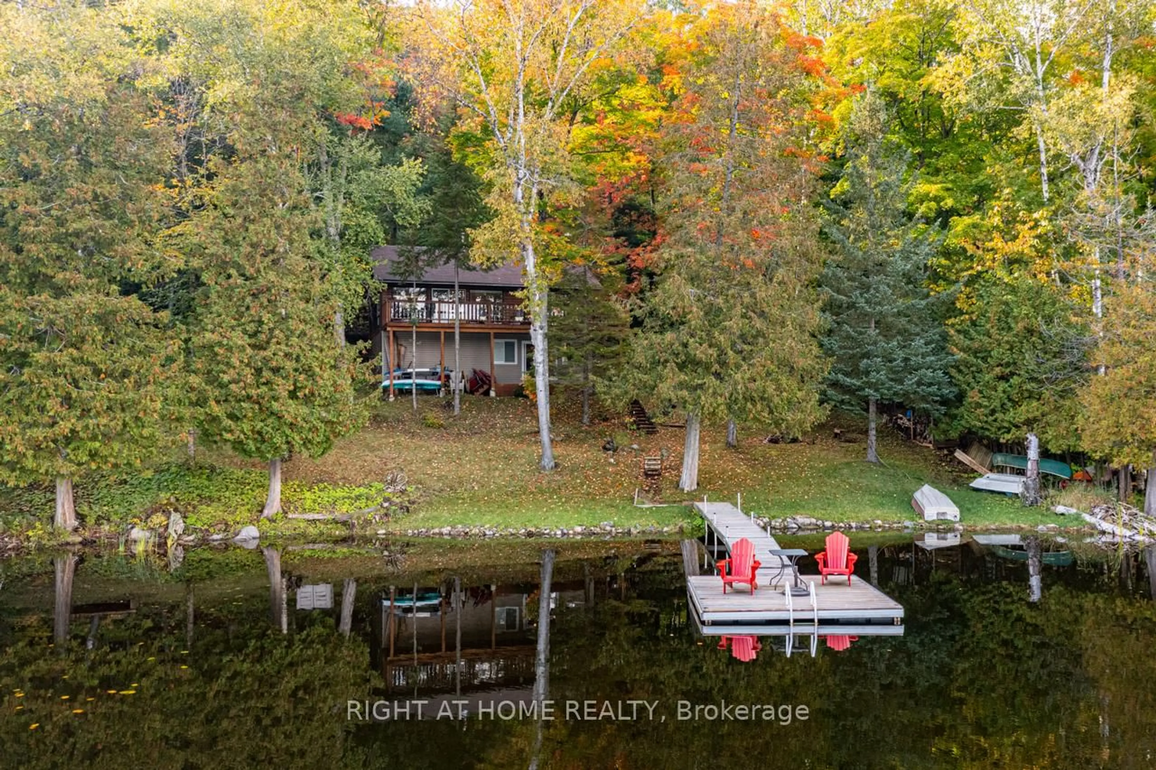 A pic from outside/outdoor area/front of a property/back of a property/a pic from drone, water/lake/river/ocean view for 1220 Portage Lake Rd, Dysart et al Ontario K0M 1S0