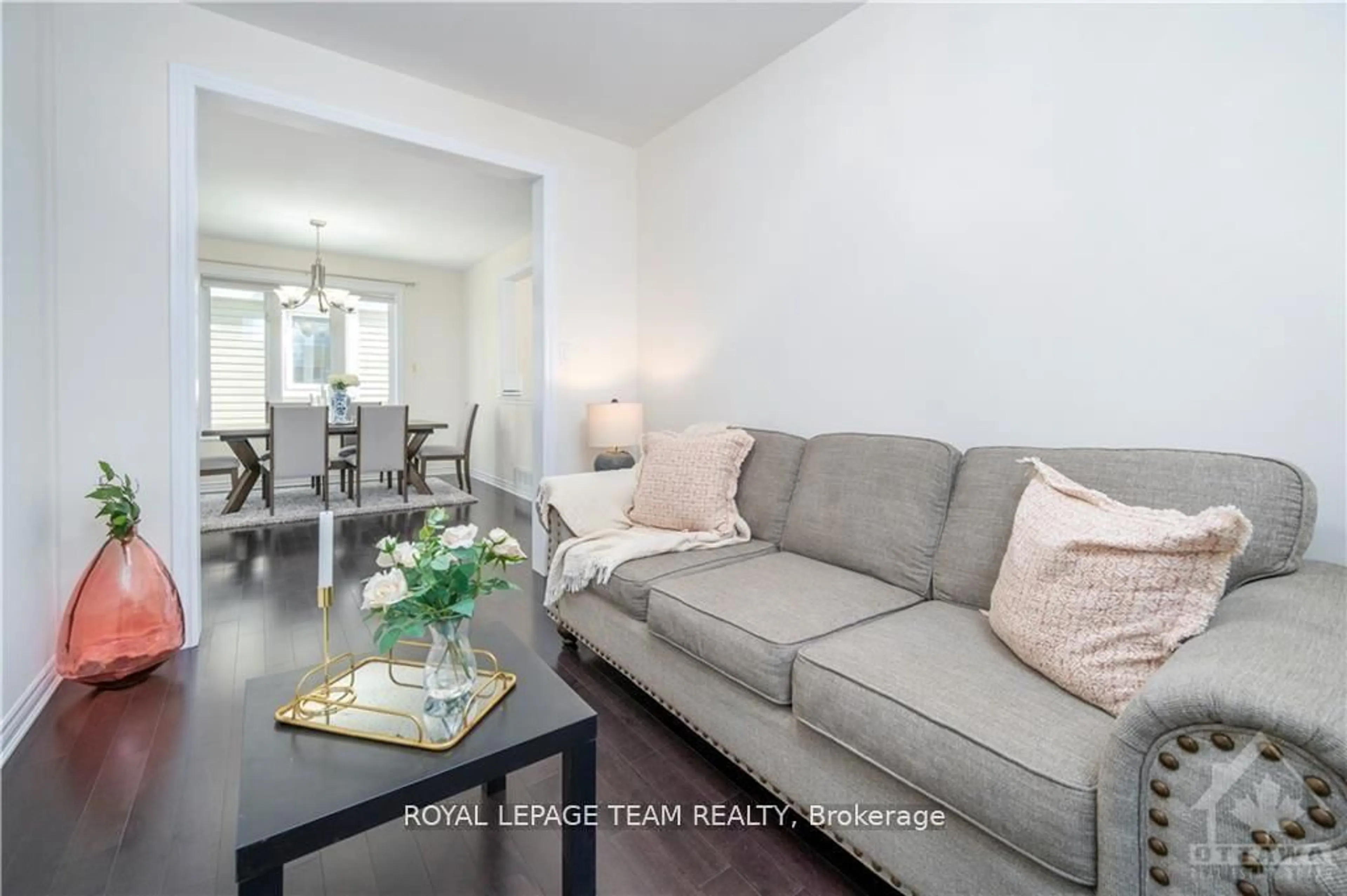 Living room with furniture, wood/laminate floor for 161 Andre Audet Ave, Ottawa Ontario K2J 5Z2