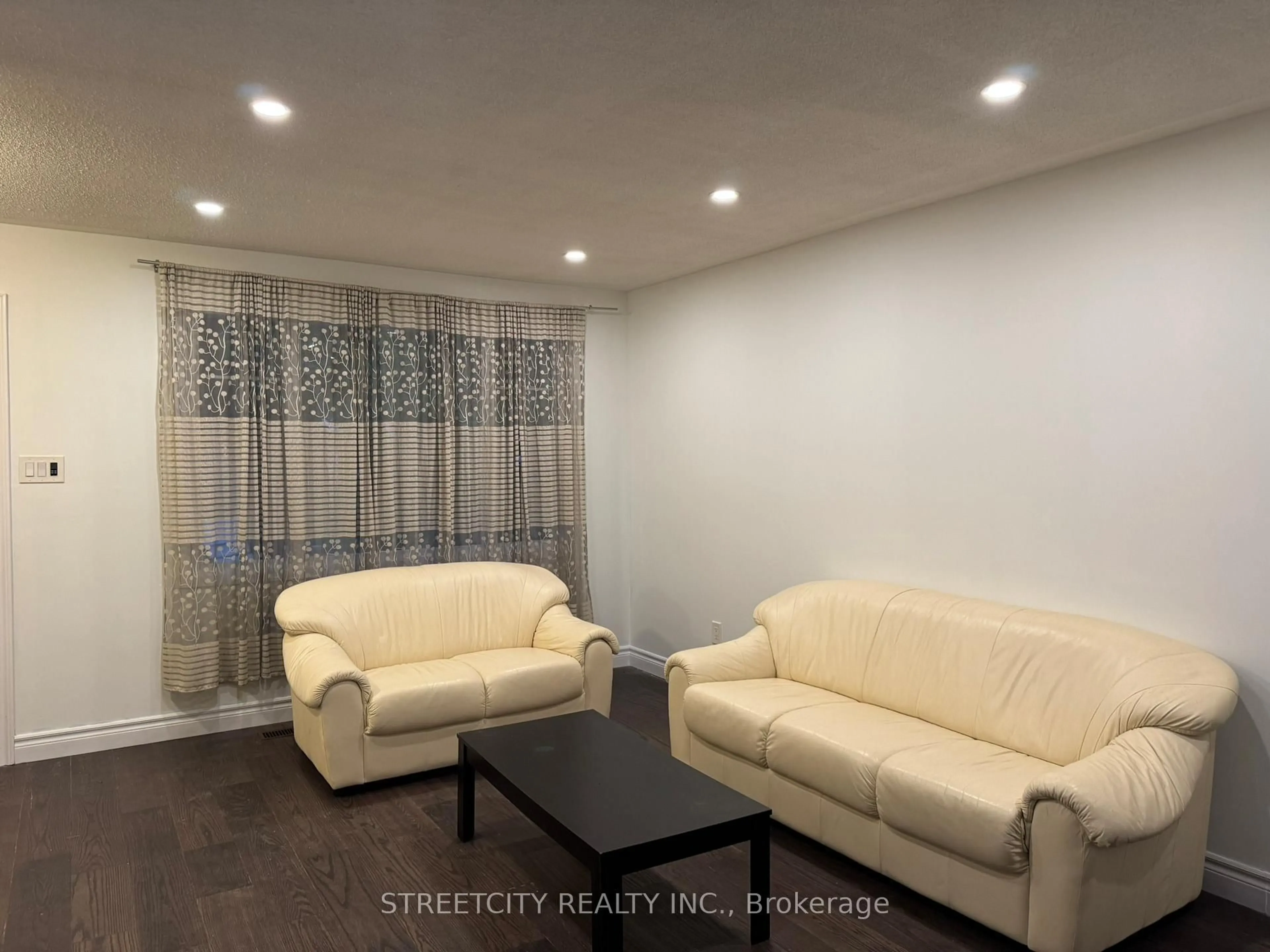 Living room with furniture, wood/laminate floor for 102 Paperbirch Cres, London North Ontario N6G 1L7