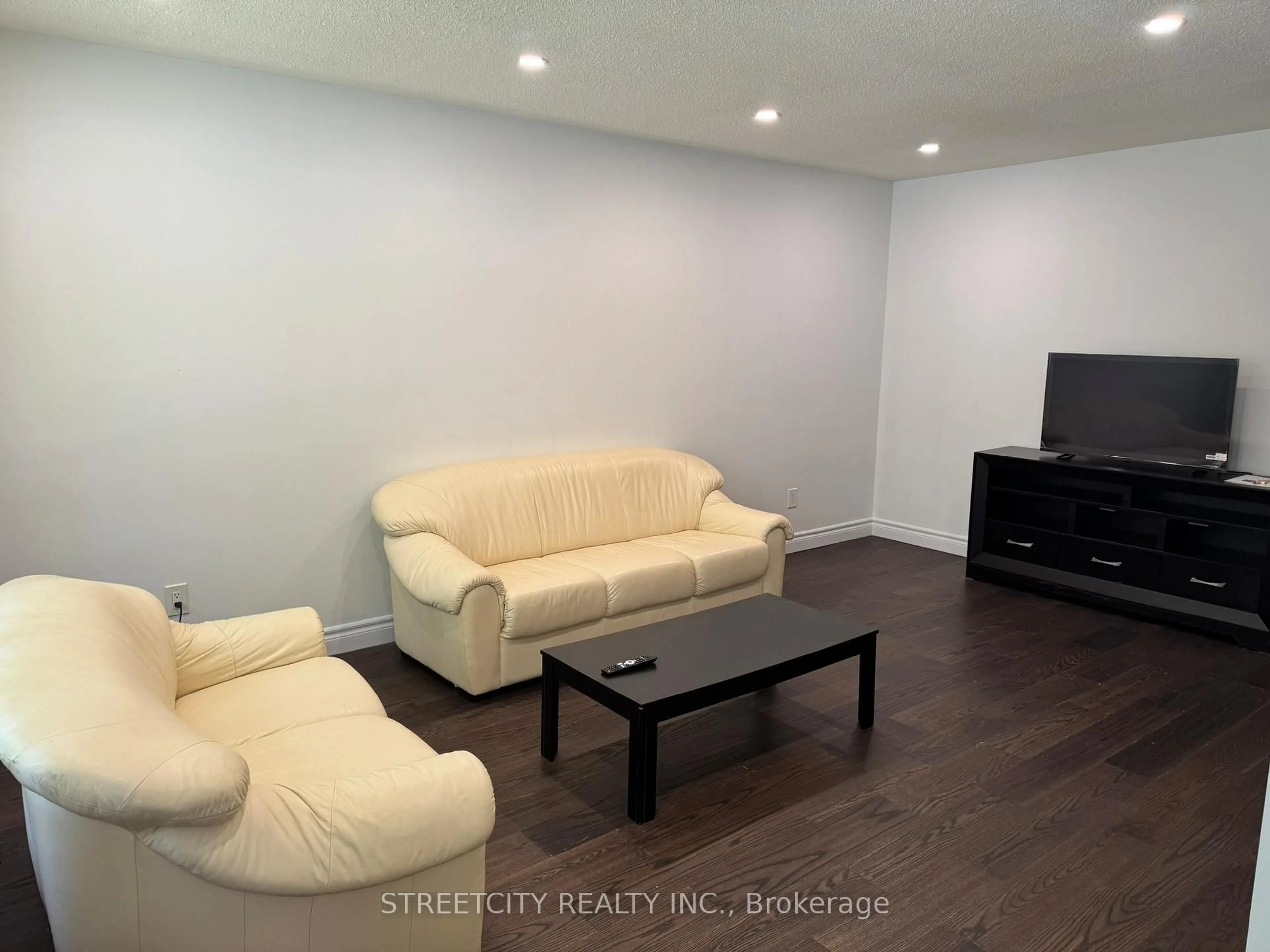 Living room with furniture, wood/laminate floor for 102 Paperbirch Cres, London North Ontario N6G 1L7