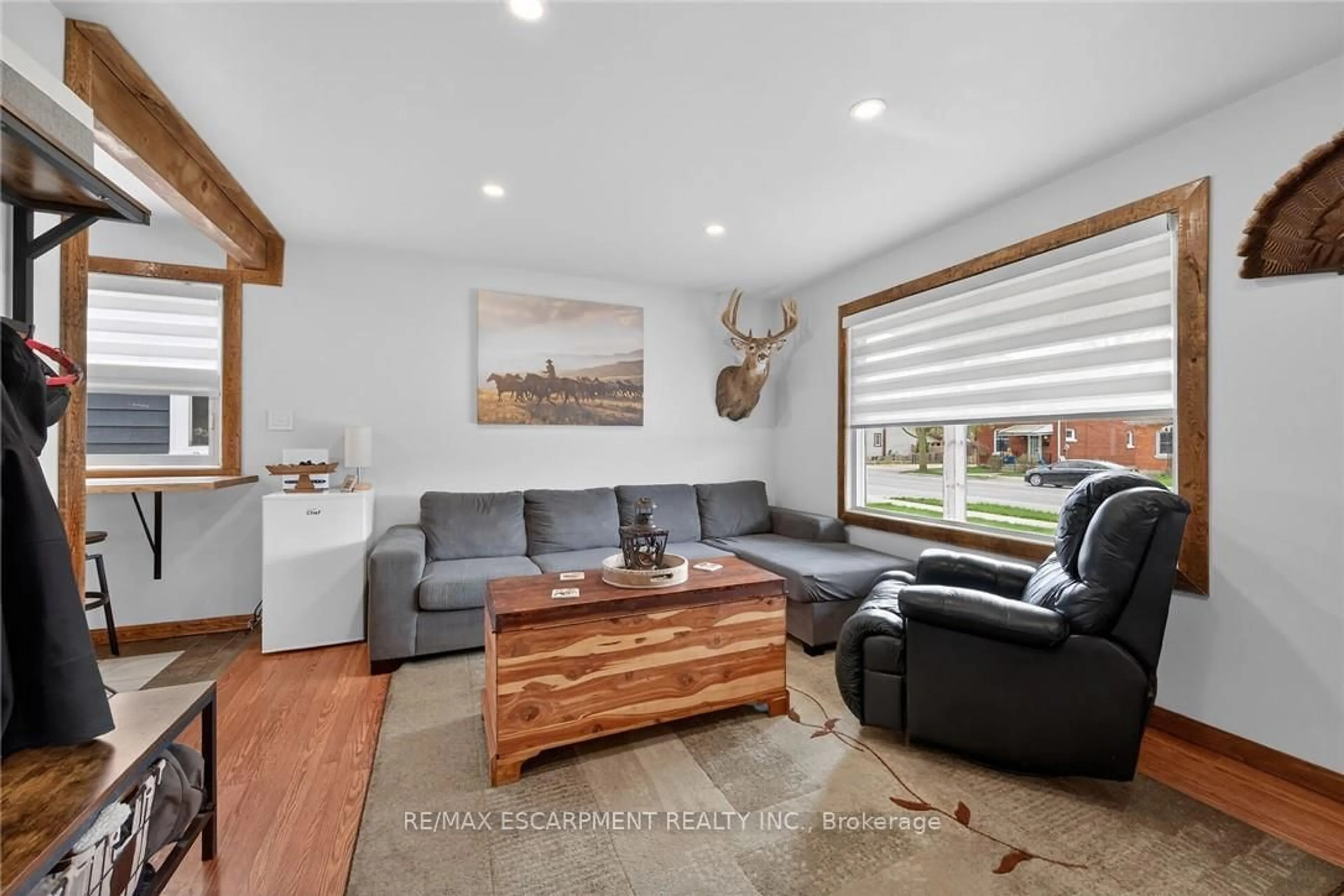 Living room with furniture, wood/laminate floor for 184 Elgin St, Brantford Ontario N3S 5A6