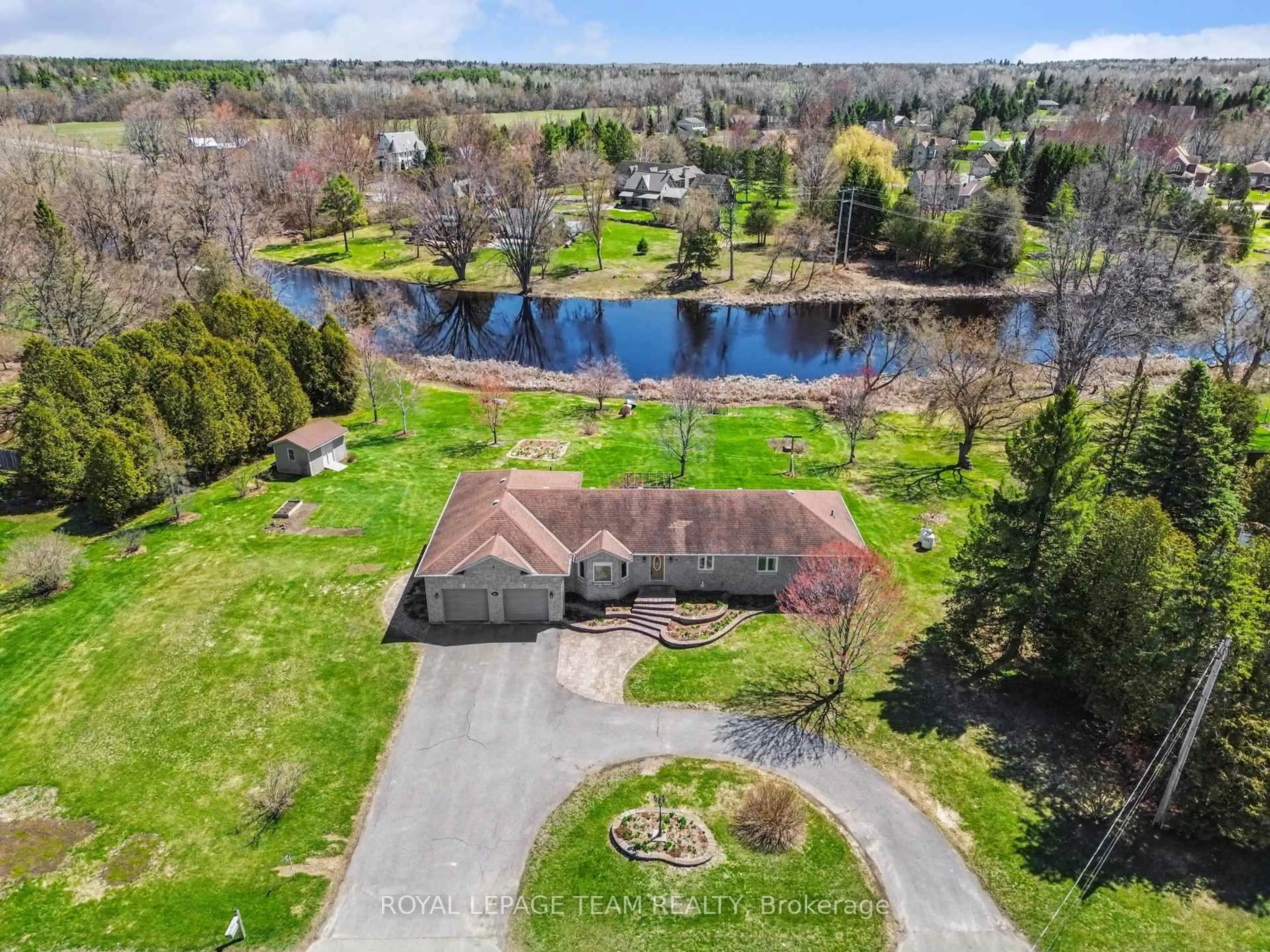 A pic from outside/outdoor area/front of a property/back of a property/a pic from drone, water/lake/river/ocean view for 2370 County 18 Rd, North Grenville Ontario K0G 1J0