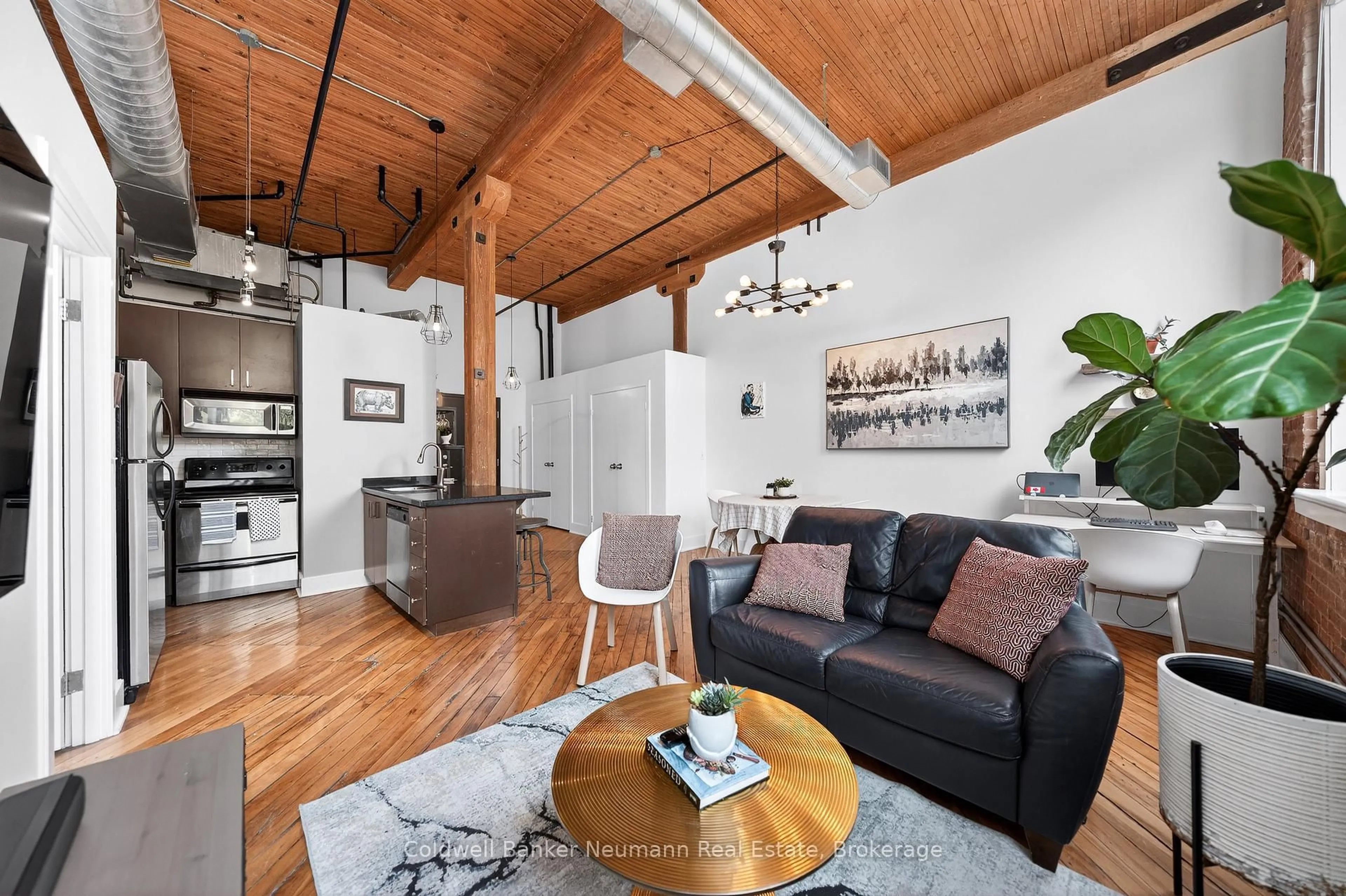 Living room with furniture, wood/laminate floor for 26 Ontario St #129, Guelph Ontario N1E 7K1