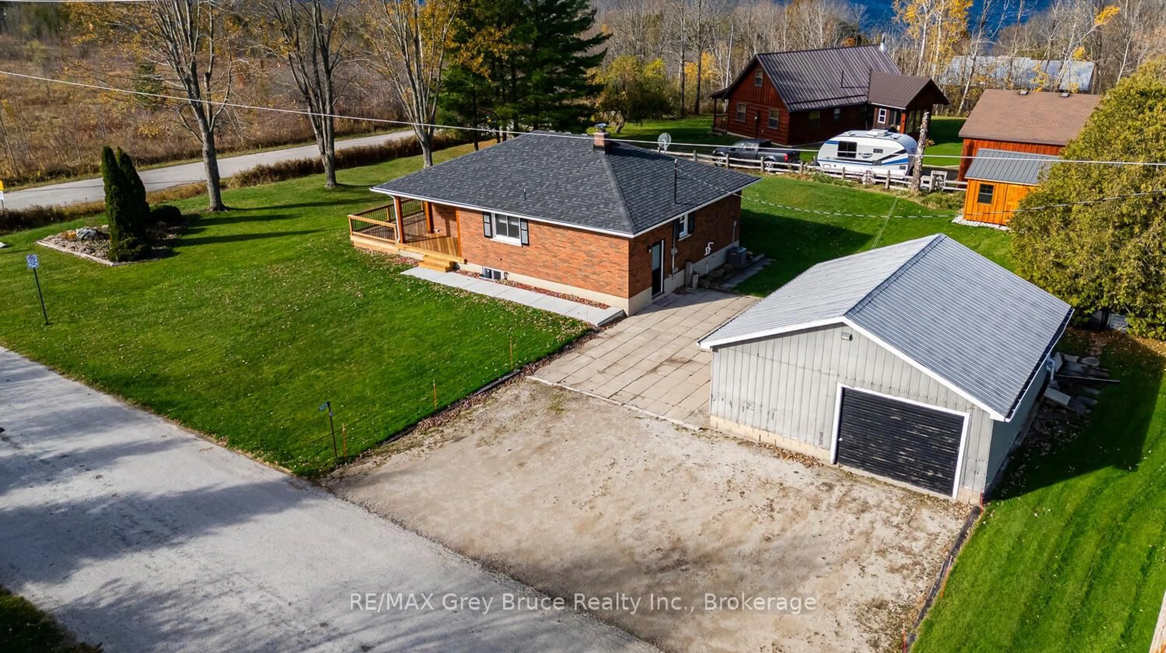 A pic from outside/outdoor area/front of a property/back of a property/a pic from drone, street for 105 John St, Georgian Bluffs Ontario N0H 2T0