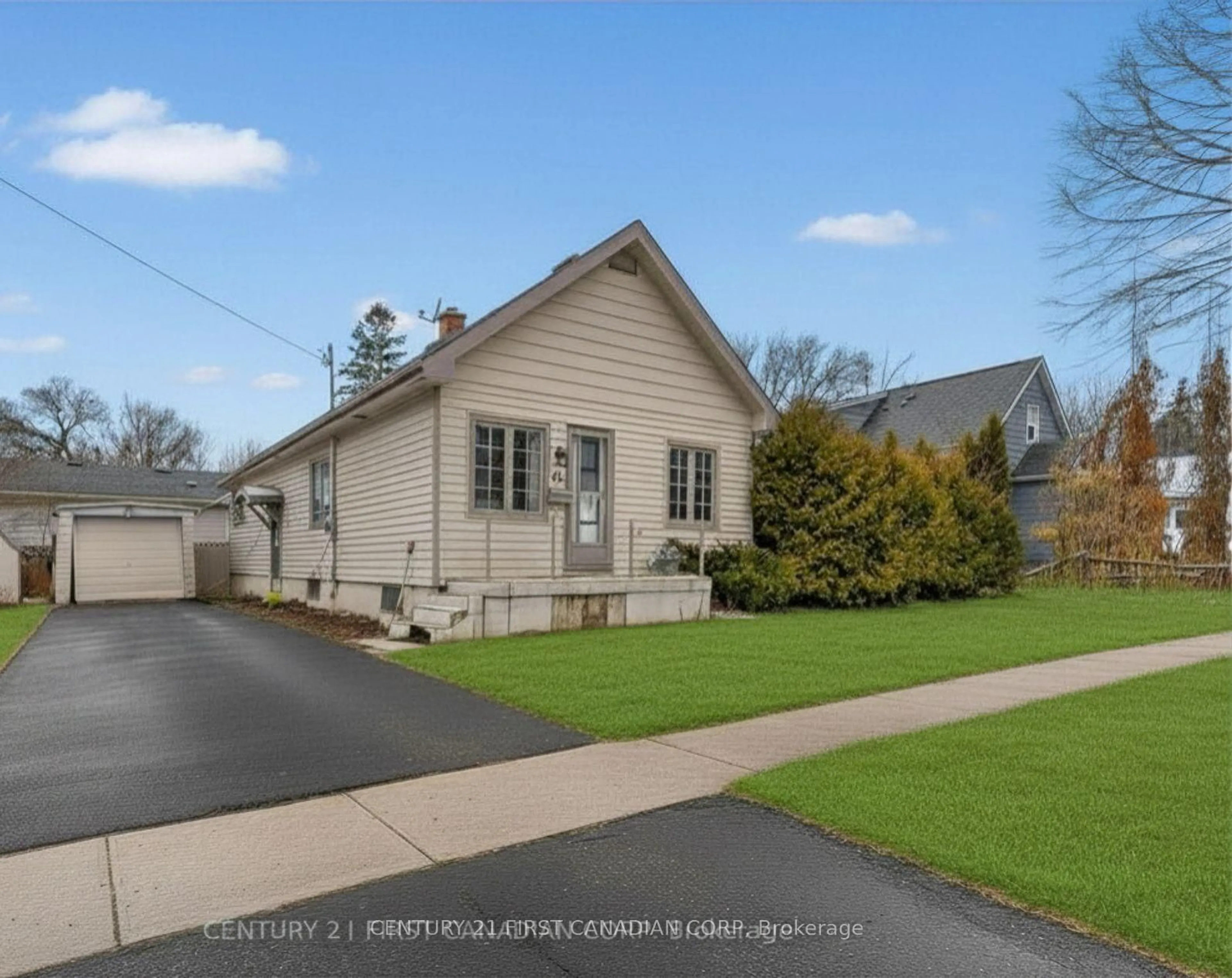 Home with vinyl exterior material, street for 49 McNay St, London East Ontario N5Y 1K8