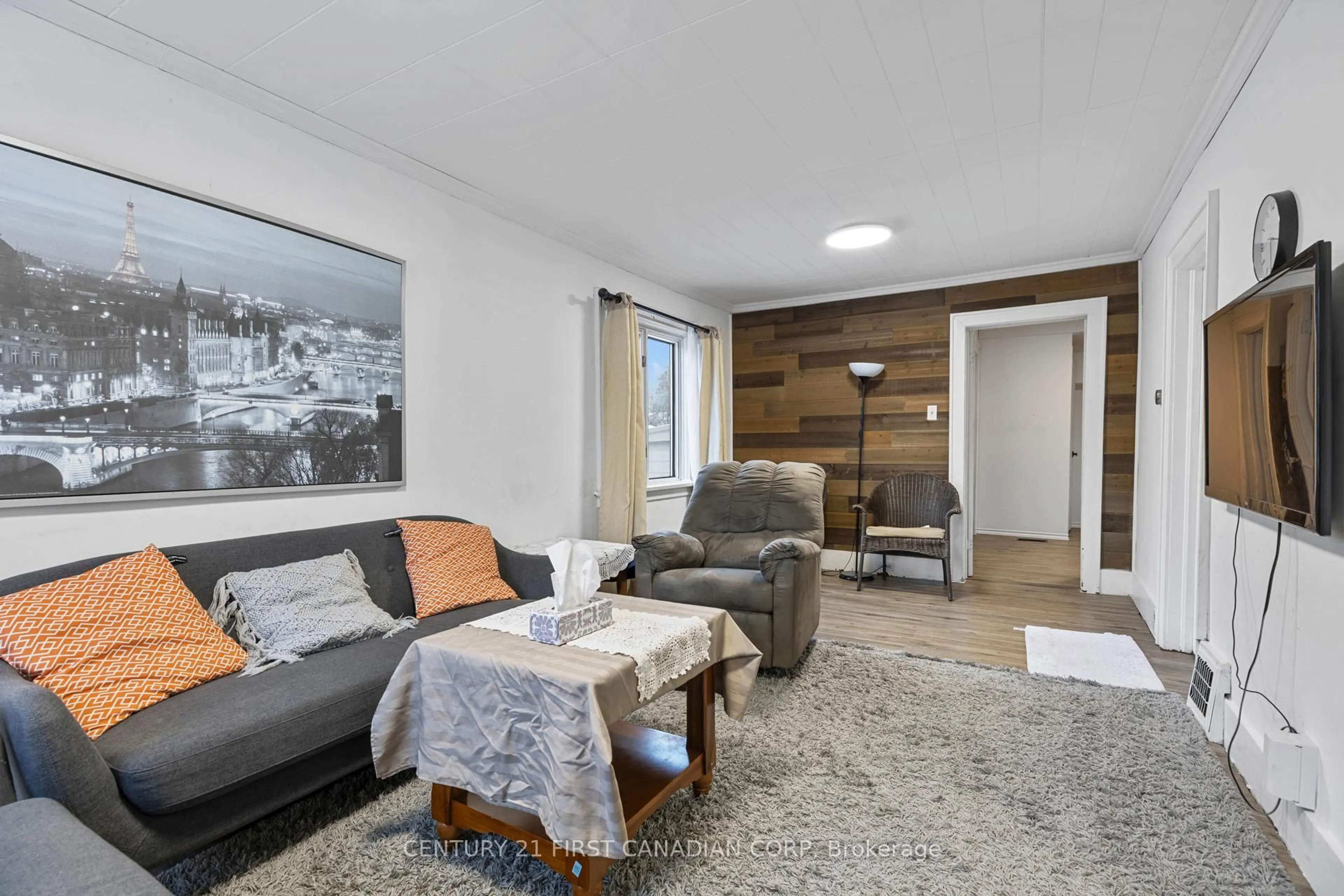 Living room with furniture, wood/laminate floor for 49 McNay St, London East Ontario N5Y 1K8