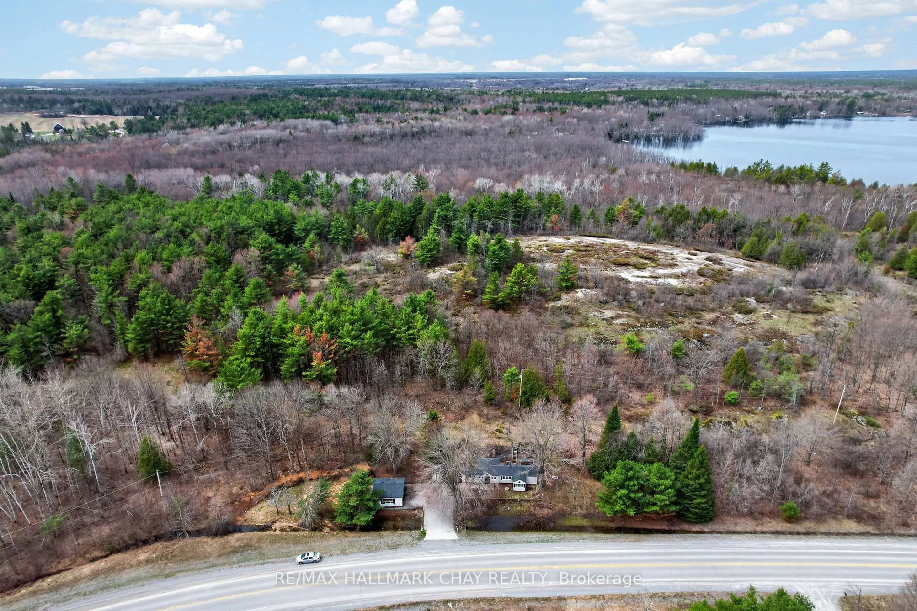 A pic from outside/outdoor area/front of a property/back of a property/a pic from drone, forest/trees view for 127 Monck Rd, Kawartha Lakes Ontario L0K 1W0