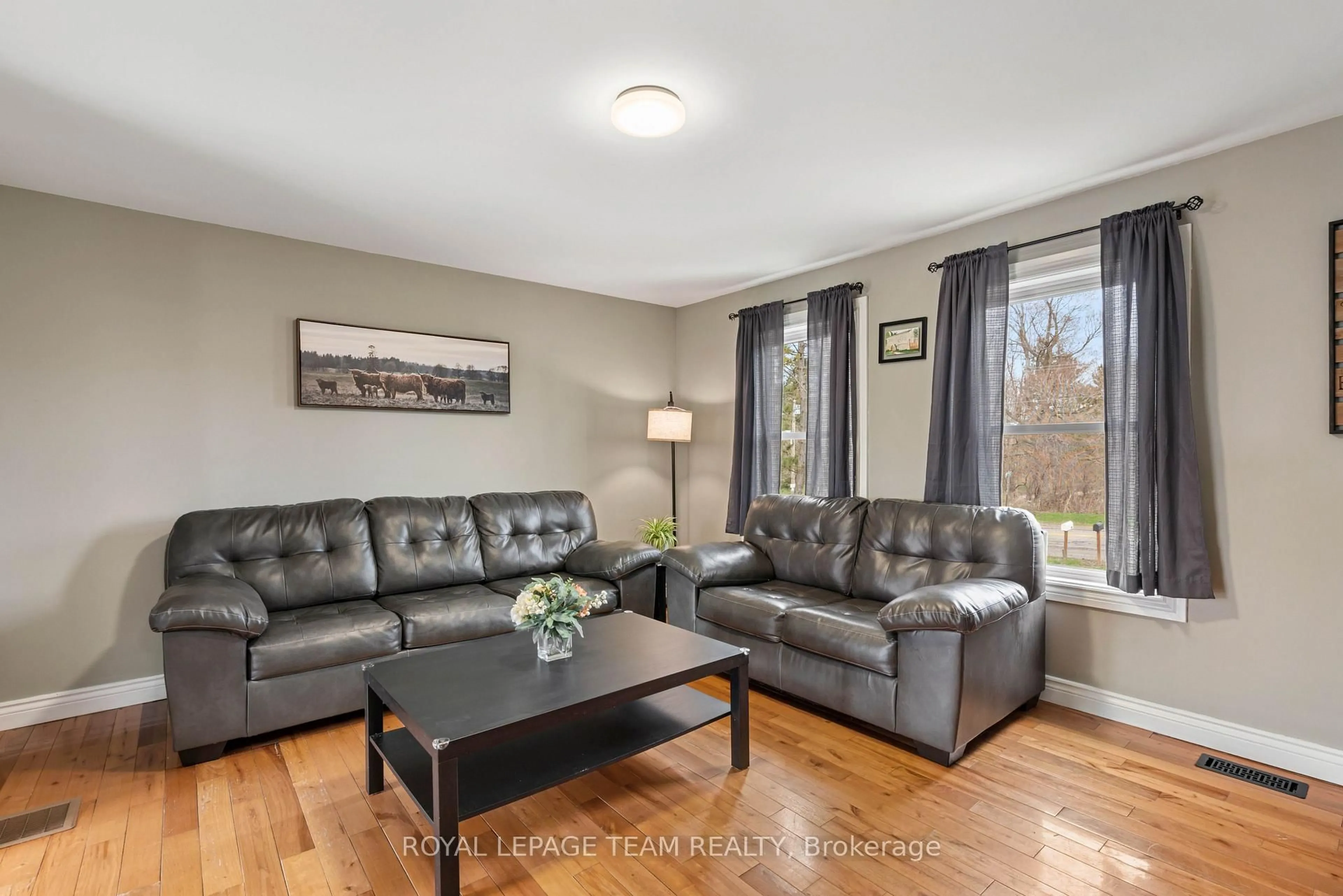Living room with furniture, wood/laminate floor for 7209 County Road 28 Rd, Elizabethtown-Kitley Ontario K6V 5T4