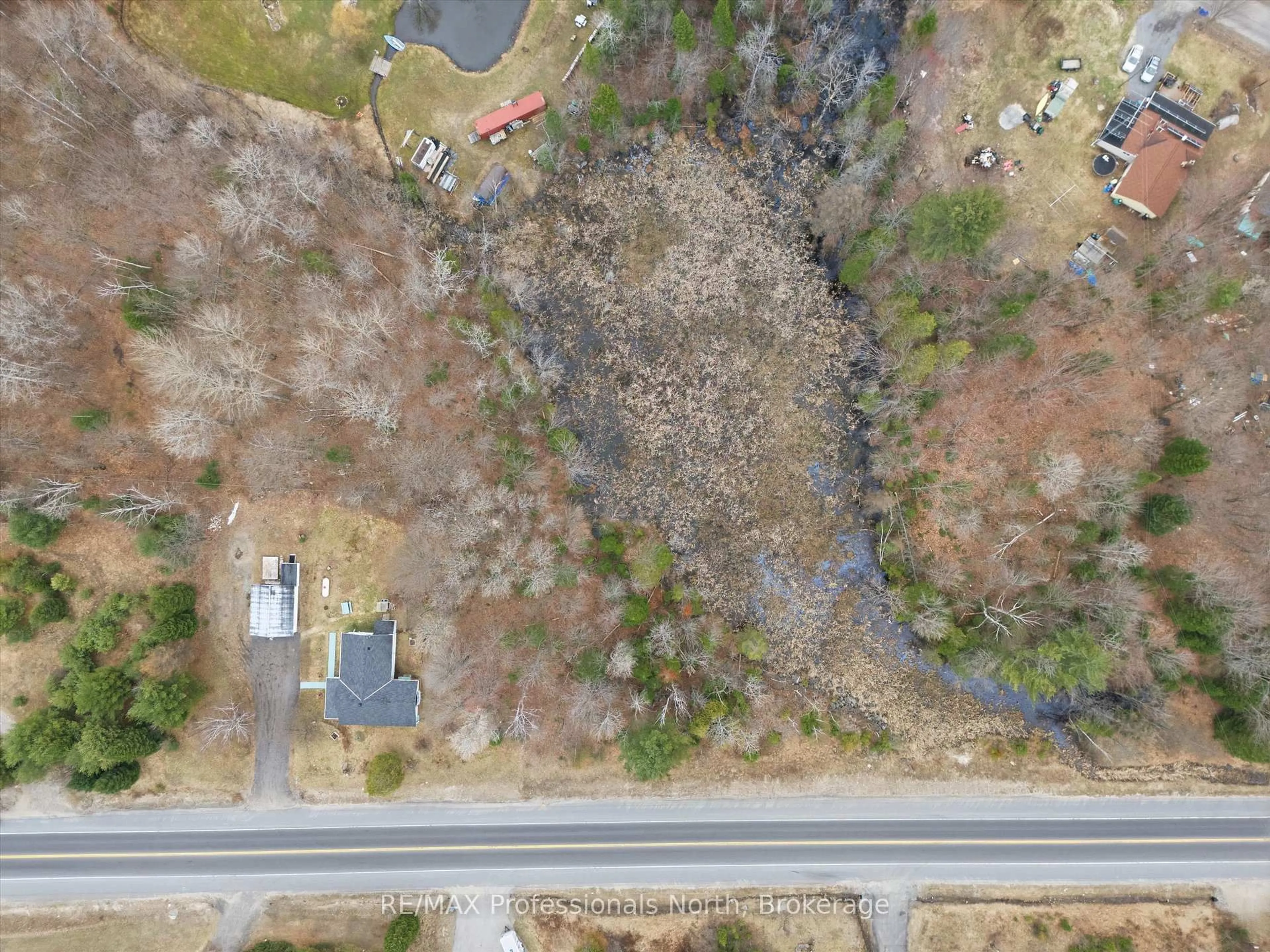 A pic from outside/outdoor area/front of a property/back of a property/a pic from drone, street for 1671 60 Highway, Huntsville Ontario P1H 1A2