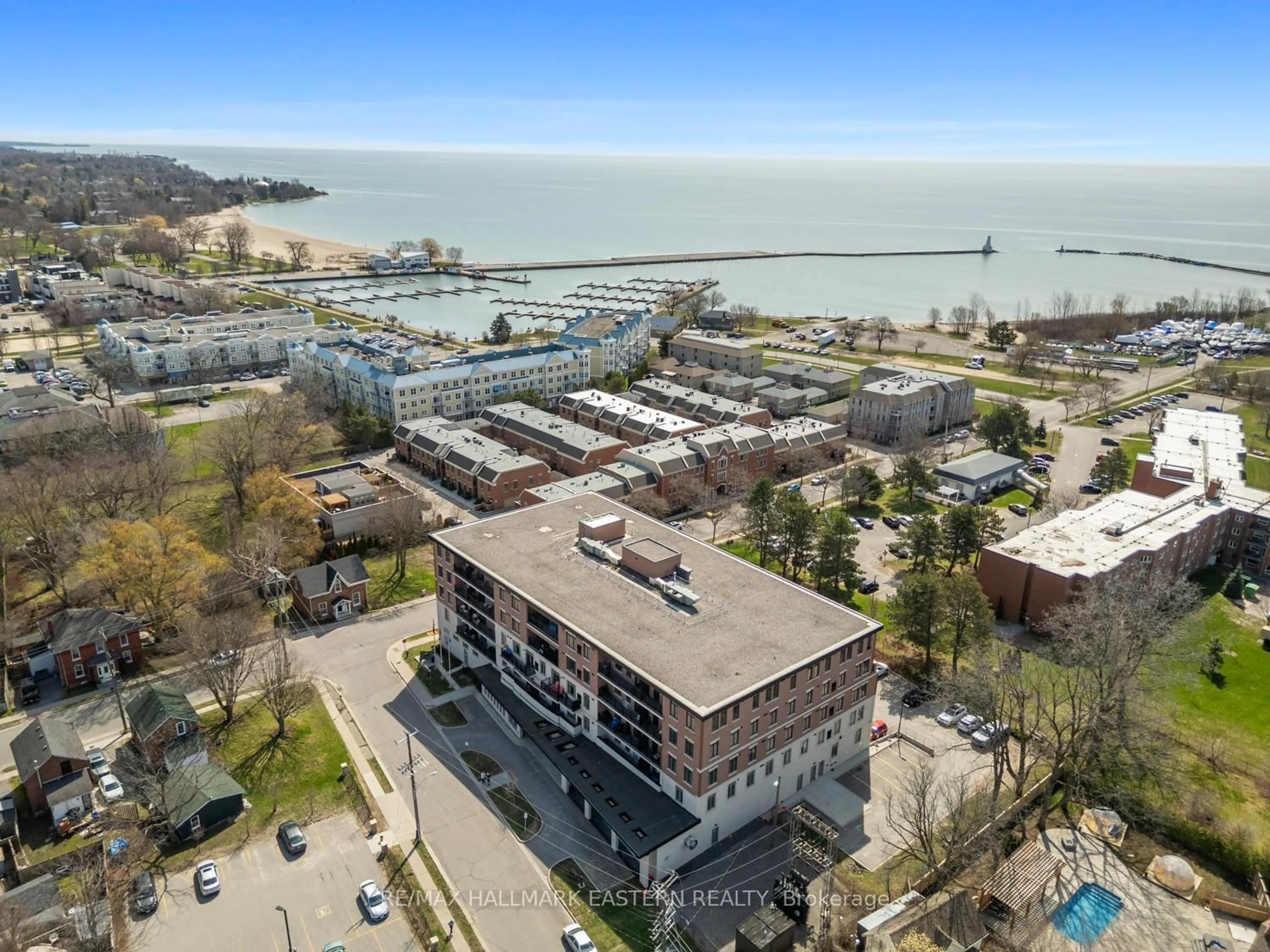 A pic from outside/outdoor area/front of a property/back of a property/a pic from drone, water/lake/river/ocean view for 135 Orr St ##407, Cobourg Ontario K9A 0J6