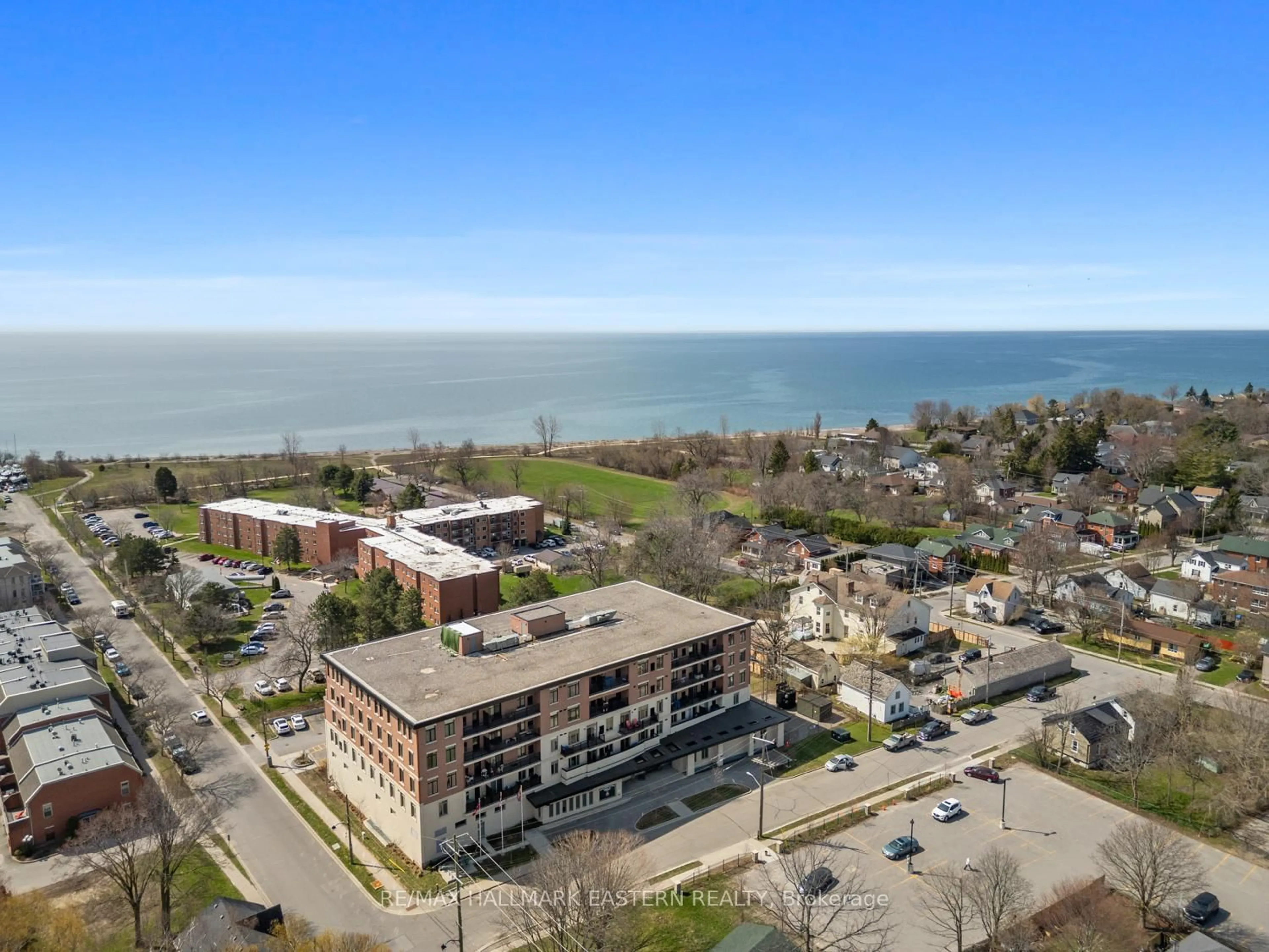 A pic from outside/outdoor area/front of a property/back of a property/a pic from drone, water/lake/river/ocean view for 135 Orr St ##407, Cobourg Ontario K9A 0J6