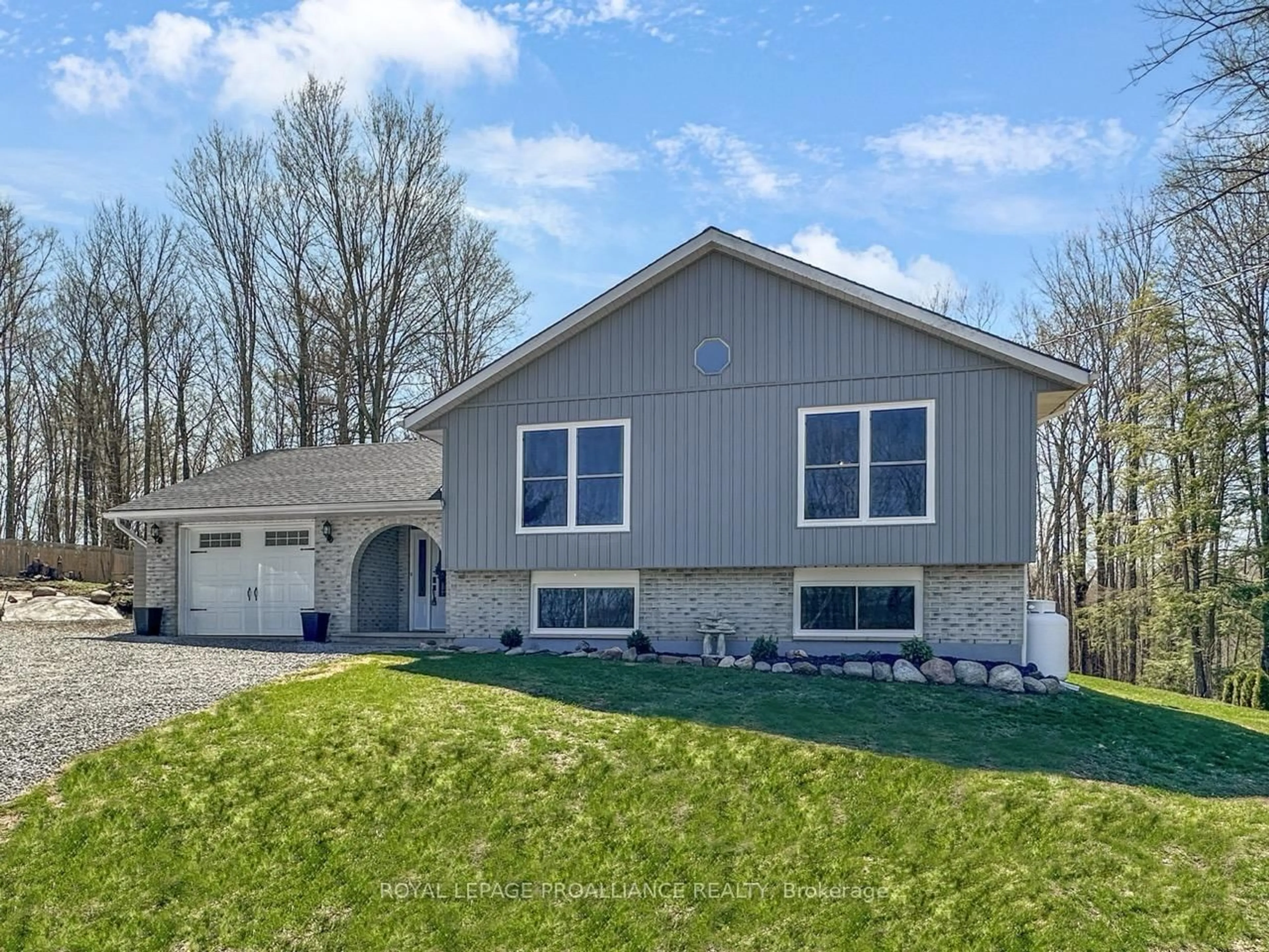 Home with vinyl exterior material, street for 83 Harts Rd, Madoc Ontario K0K 2K0