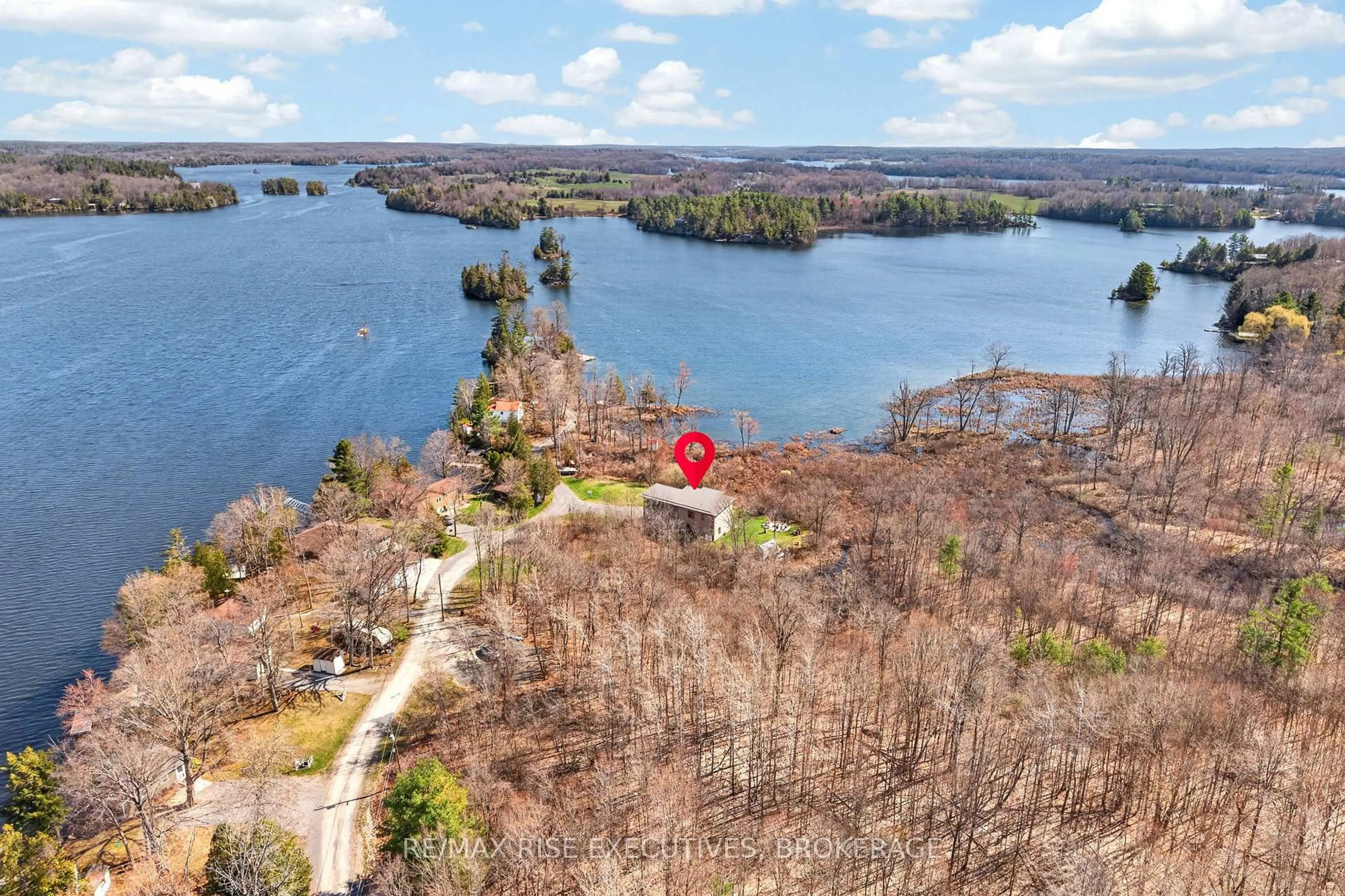 A pic from outside/outdoor area/front of a property/back of a property/a pic from drone, water/lake/river/ocean view for 4646 Stair Step Lane, Battersea Ontario K0H 1H0