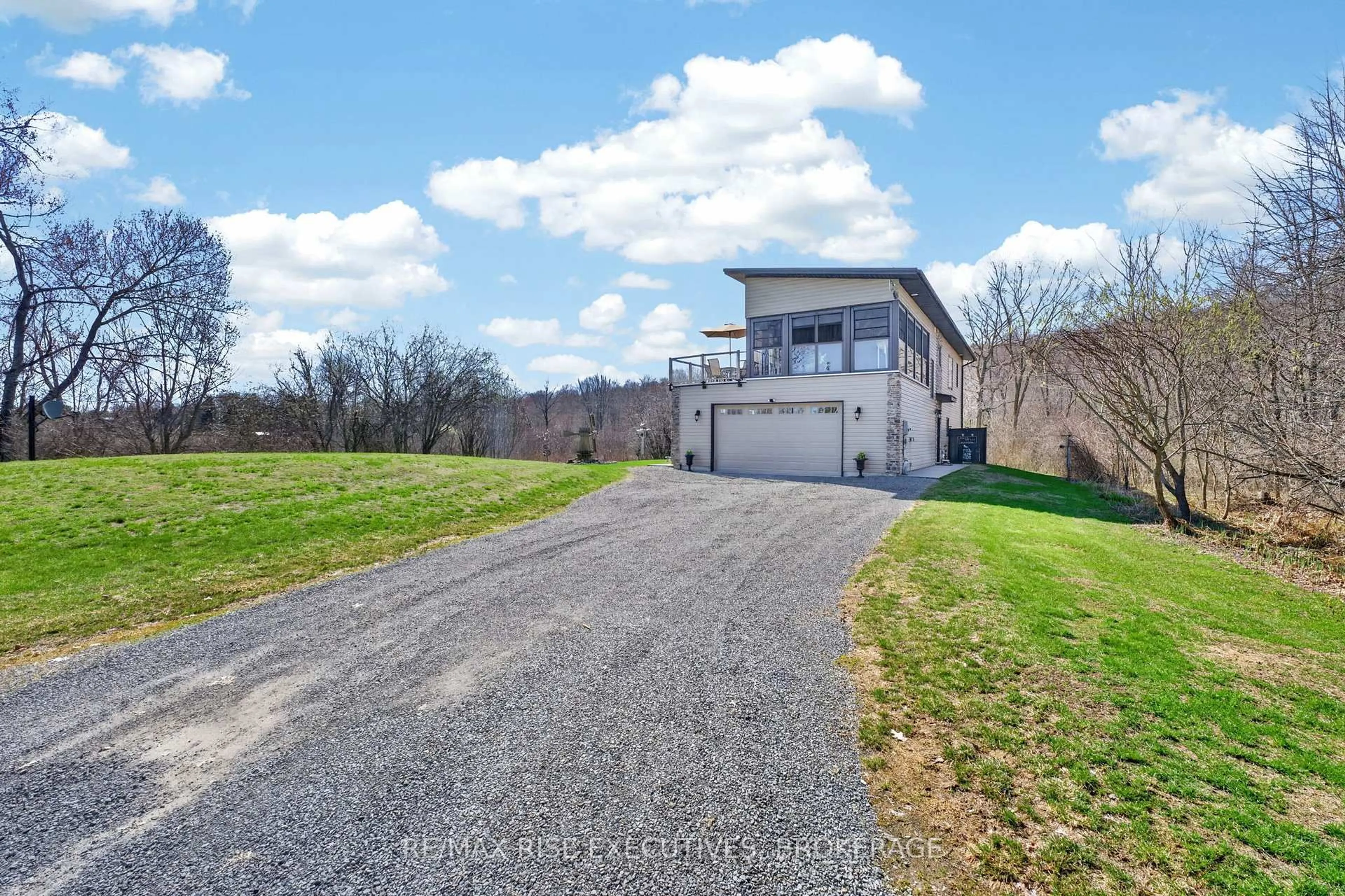 A pic from outside/outdoor area/front of a property/back of a property/a pic from drone, street for 4646 Stair Step Lane, Battersea Ontario K0H 1H0