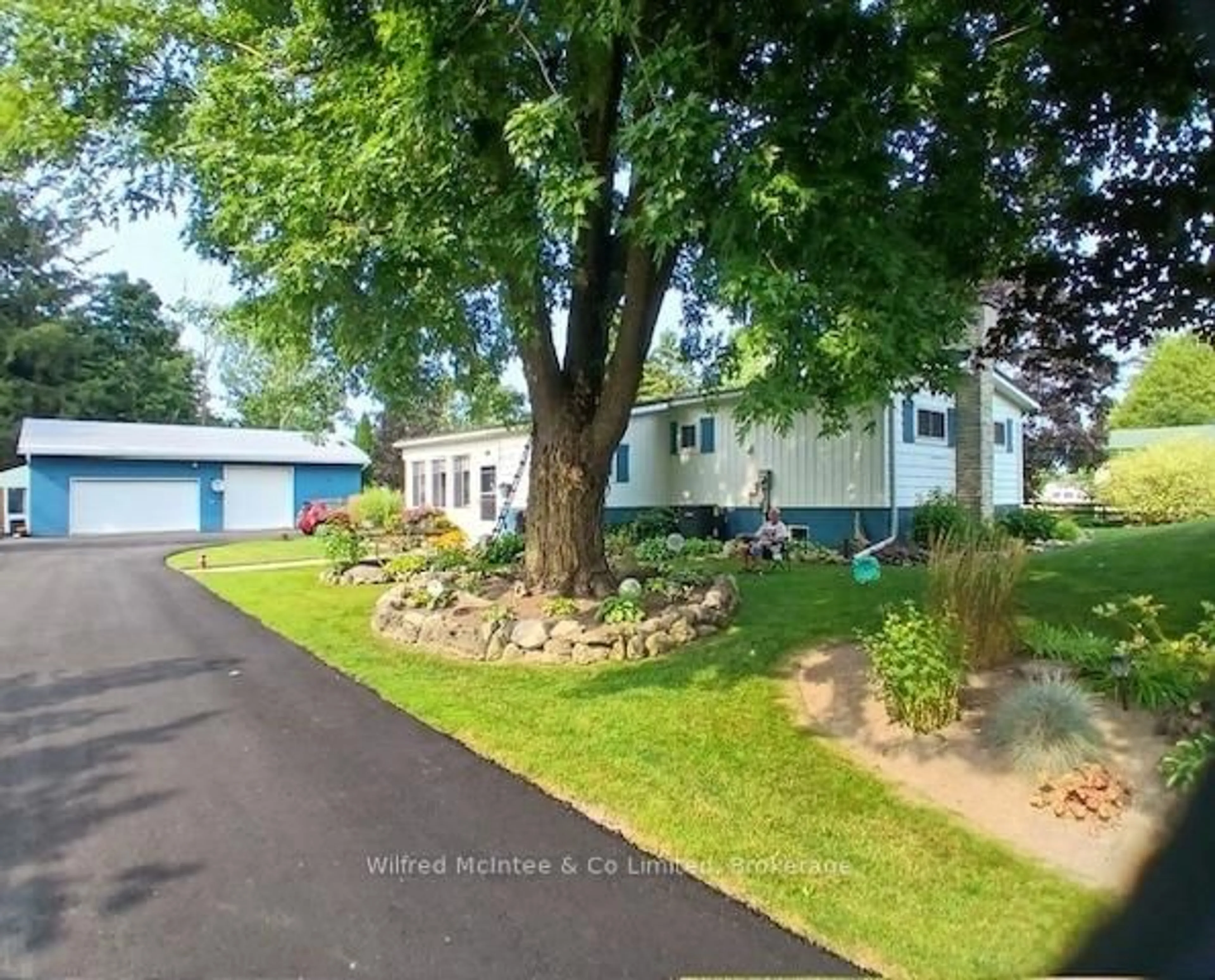 A pic from outside/outdoor area/front of a property/back of a property/a pic from drone, street for 21571 Grey Road 16, Georgian Bluffs Ontario N0H 2N0