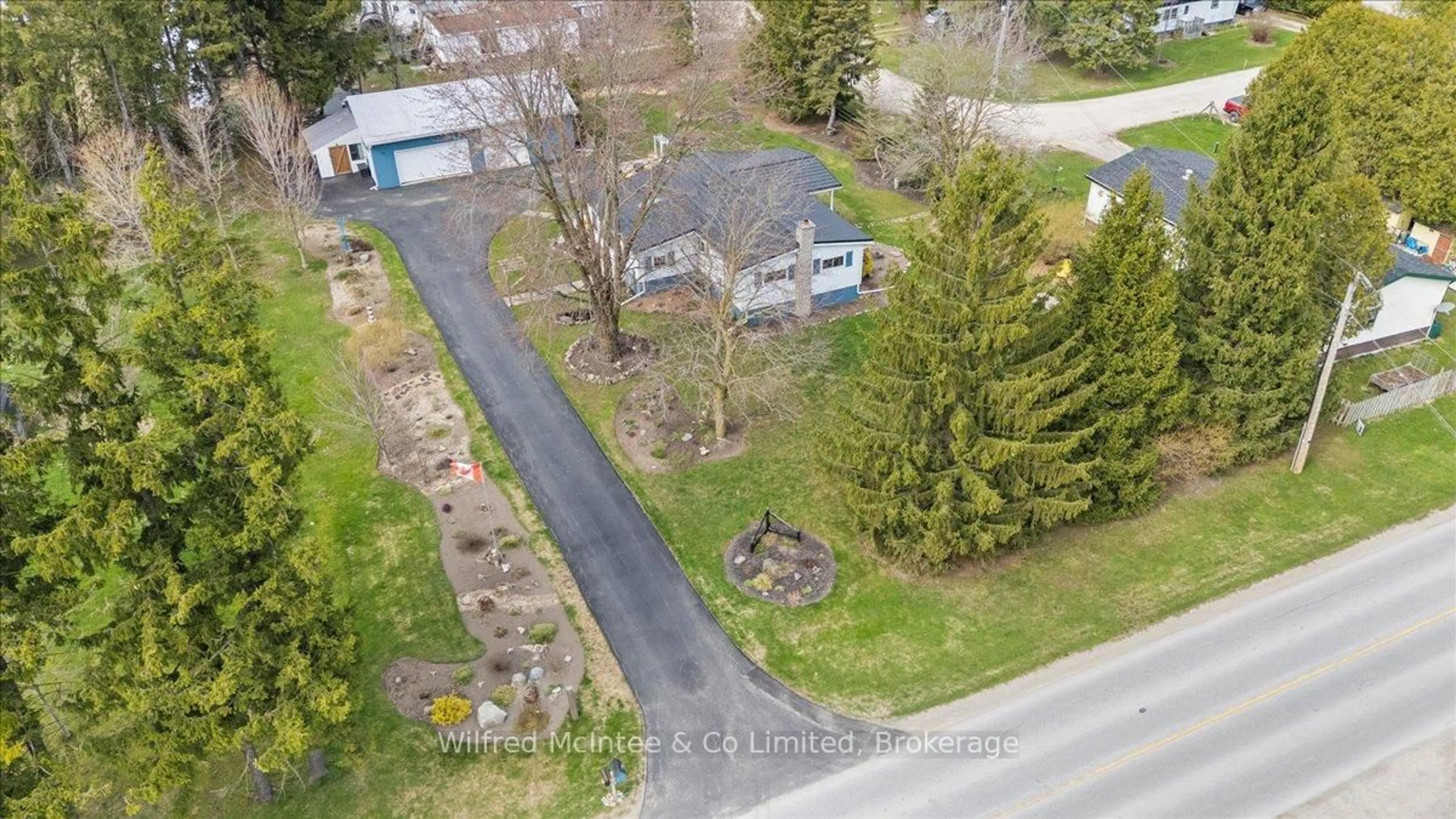 A pic from outside/outdoor area/front of a property/back of a property/a pic from drone, street for 21571 Grey Road 16, Georgian Bluffs Ontario N0H 2N0