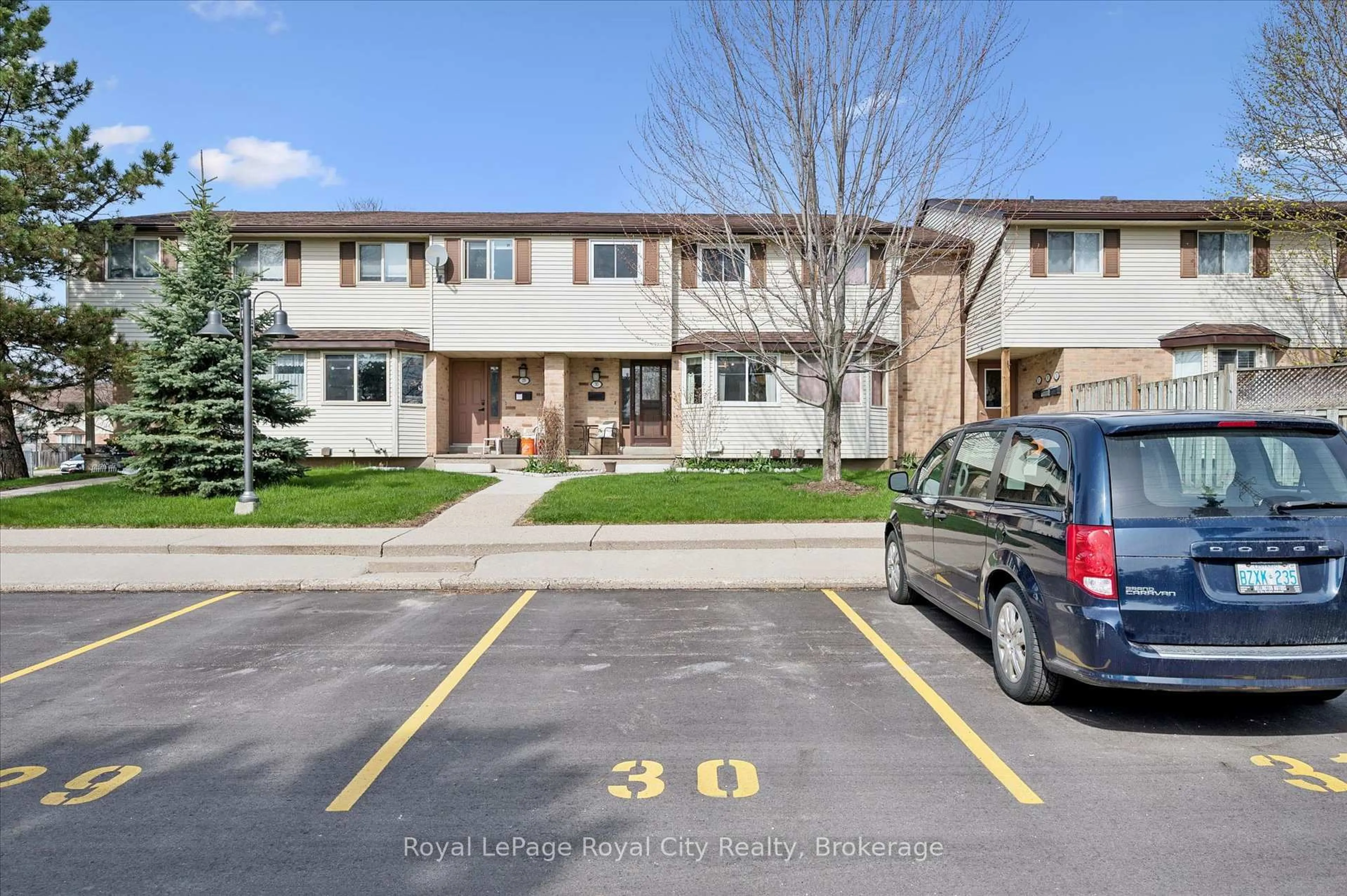 A pic from outside/outdoor area/front of a property/back of a property/a pic from drone, street for 40 Silvercreek Pkwy #30, Guelph Ontario N1H 7X5