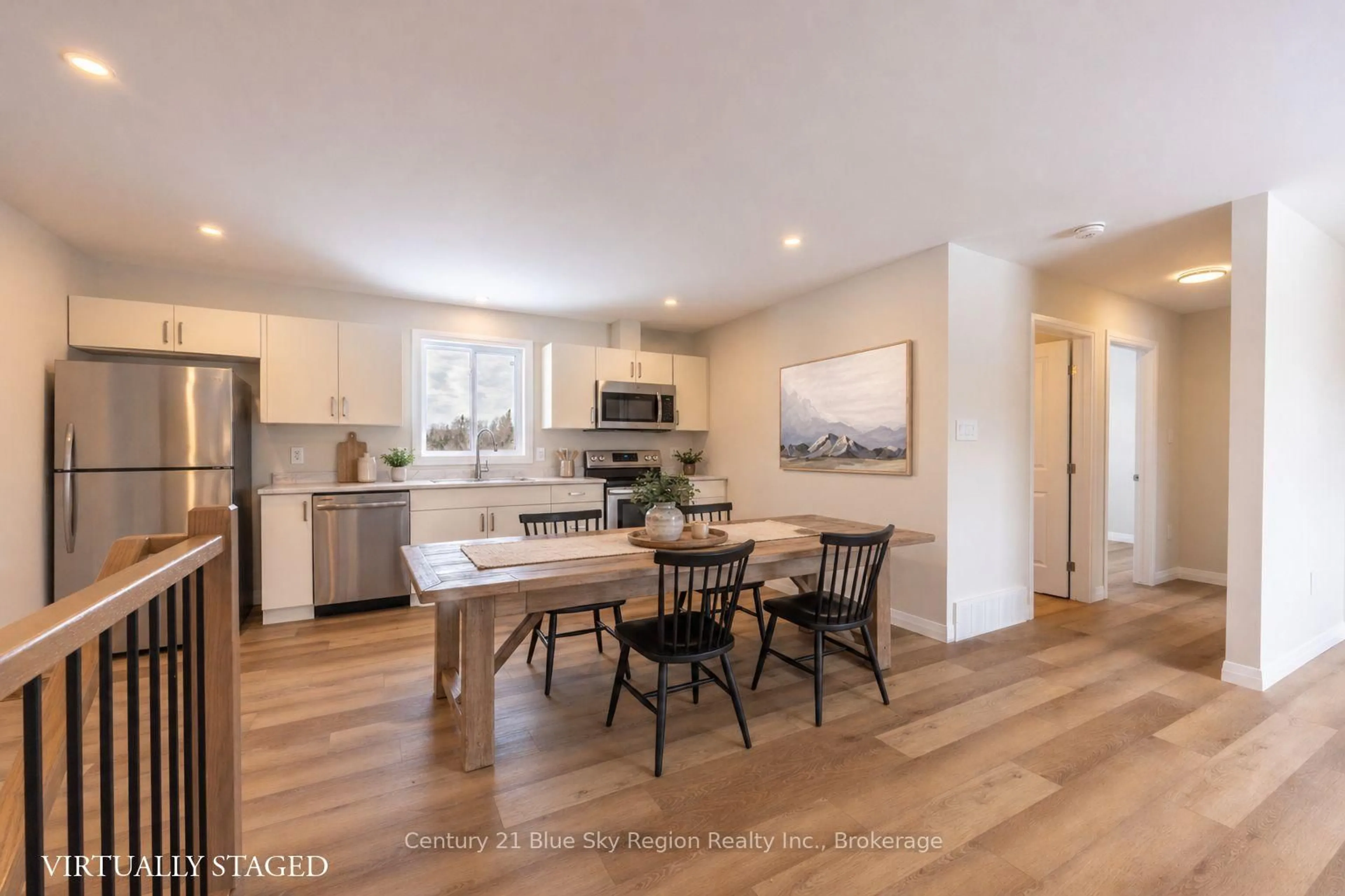 Open concept kitchen, wood/laminate floor for 201 Talon Cres, Bonfield Ontario P0H 2E0