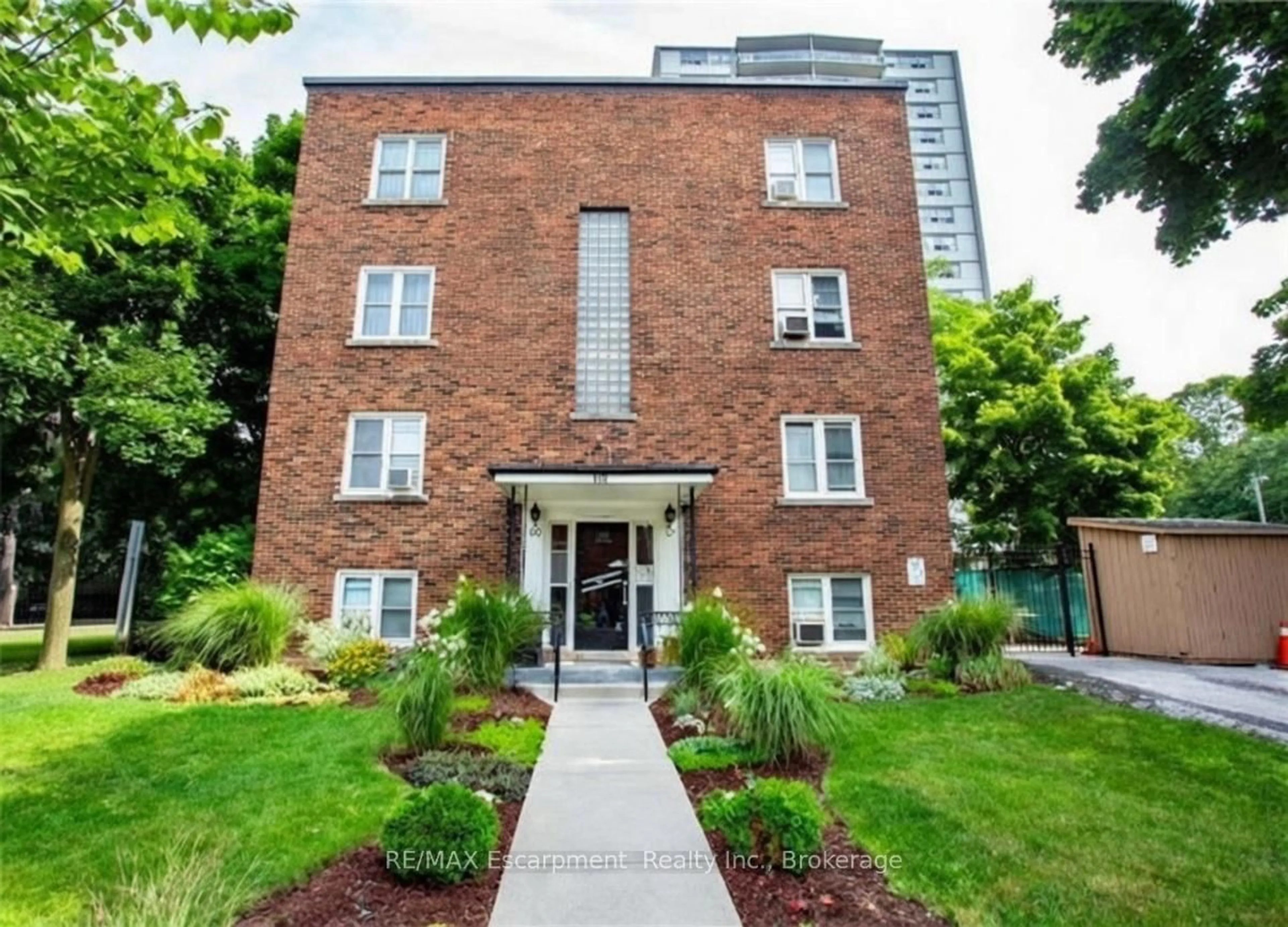 Home with brick exterior material, street for 60 Robinson St #305, Hamilton Ontario L8P 1Y9